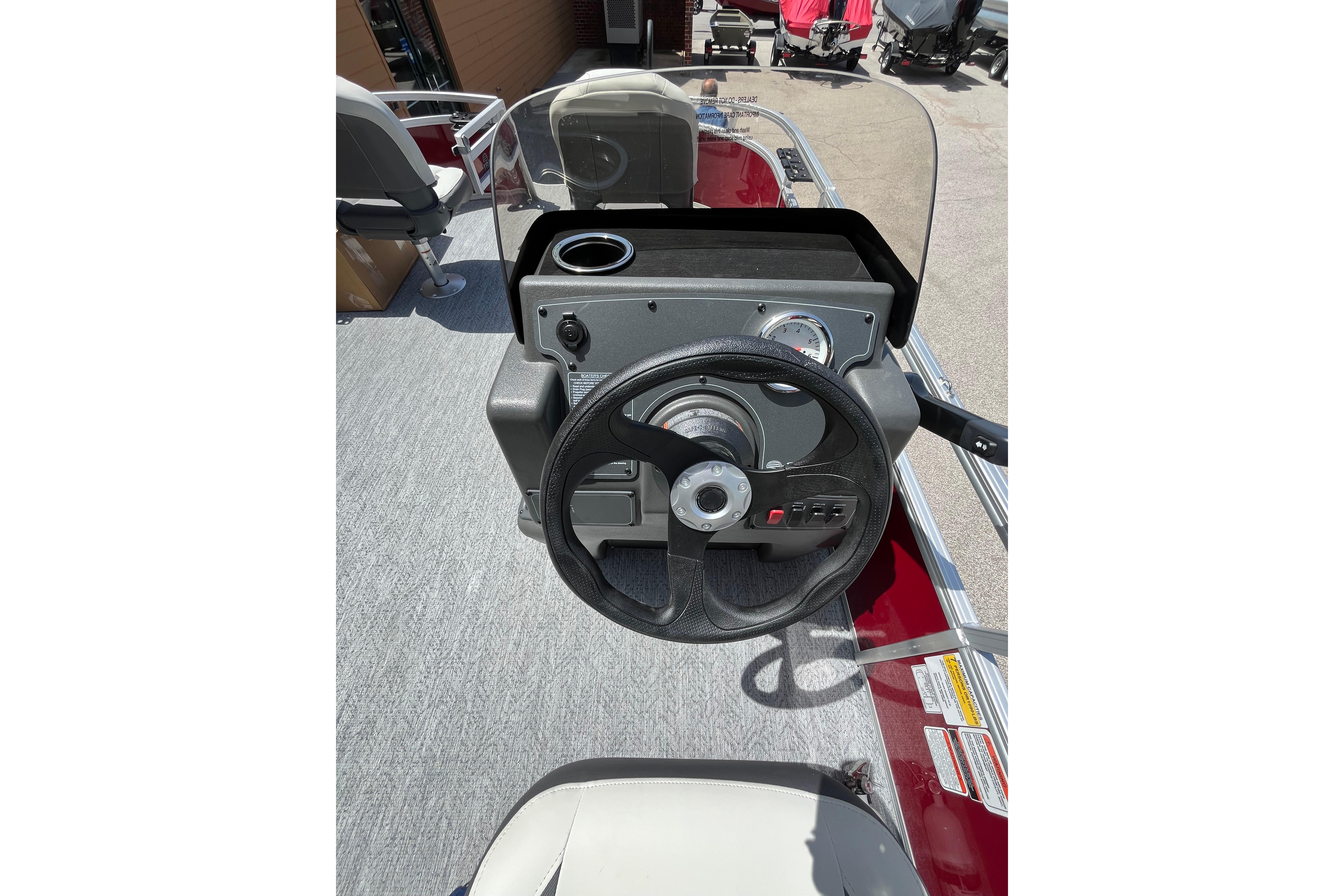 Steering console of 2026 Sun Tracker Bass Buggy 16 XL Select pontoon boat.
