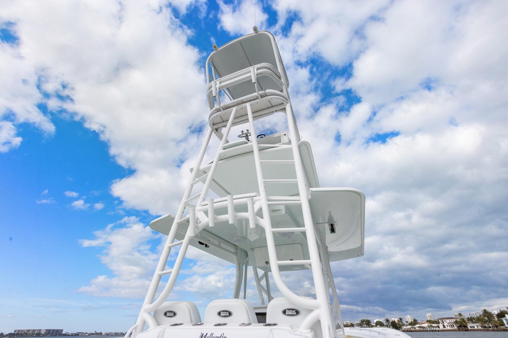 2015 Yellowfin 39 Offshore boat tower against a cloudy blue sky.