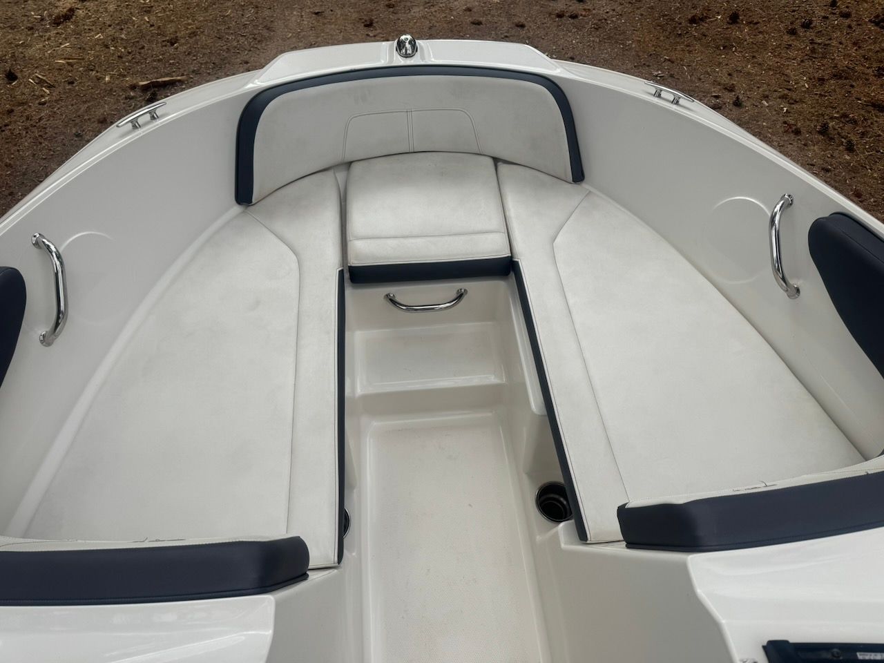 The image shows the bow area of a Sea Ray SPX 190 Outboard boat with white upholstery.
