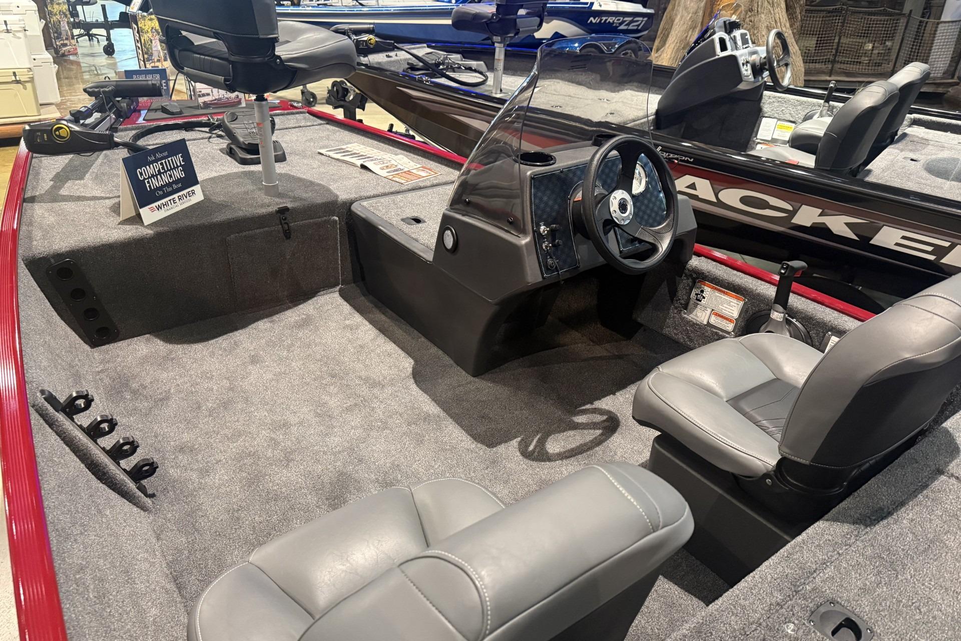 2026 Tracker Bass Tracker Classic XL boat interior with gray seating and steering console.