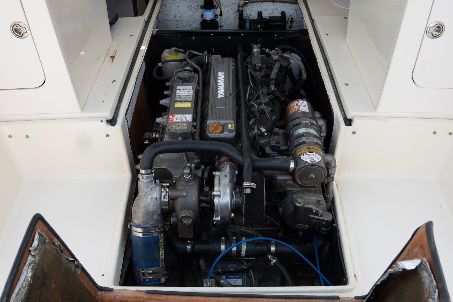 Engine compartment of 2006 Atlas Boat Works Acadia 25, featuring a Yanmar engine.