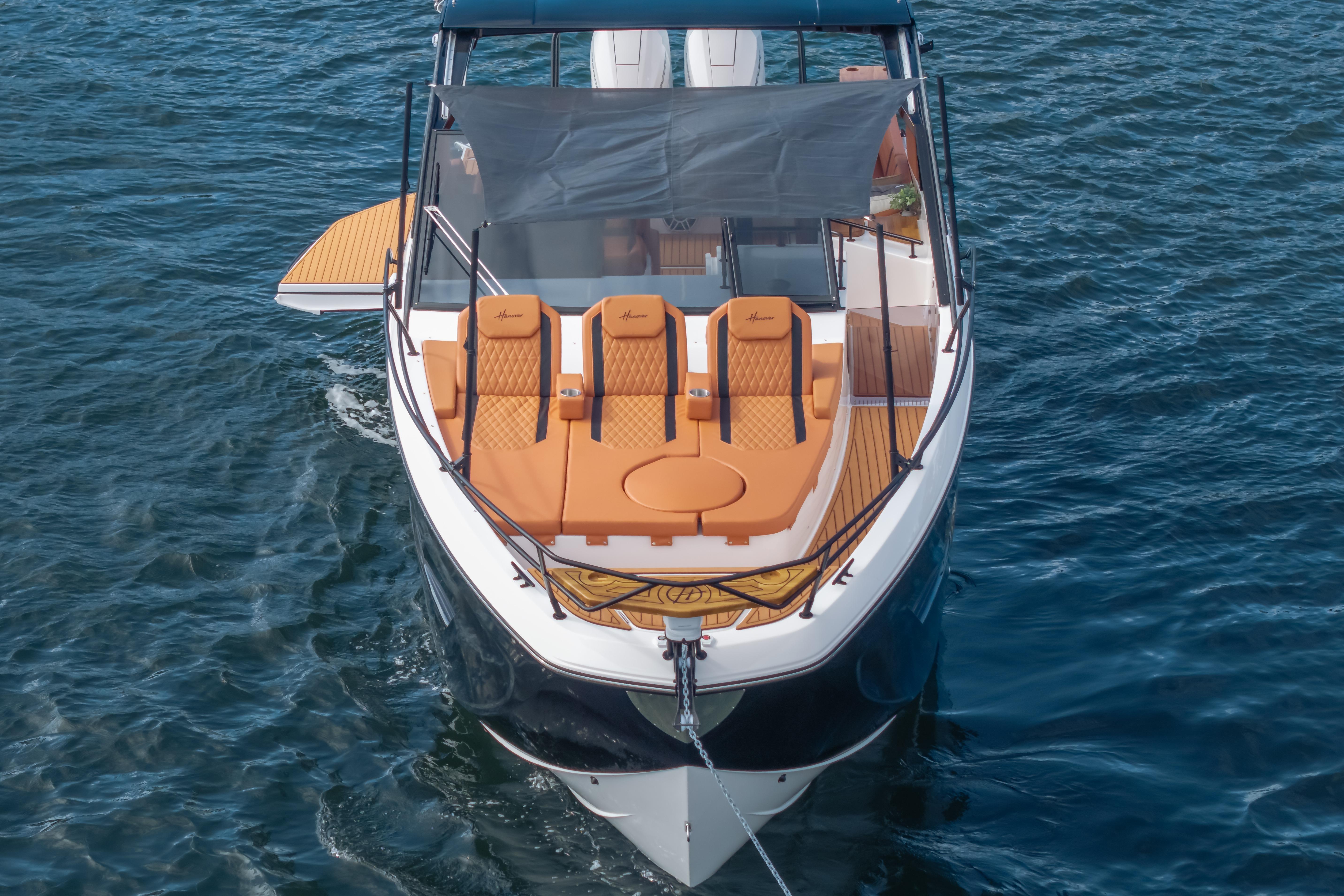 Luxurious 2026 Hanover 387 boat with sleek design and comfortable seating on open water.