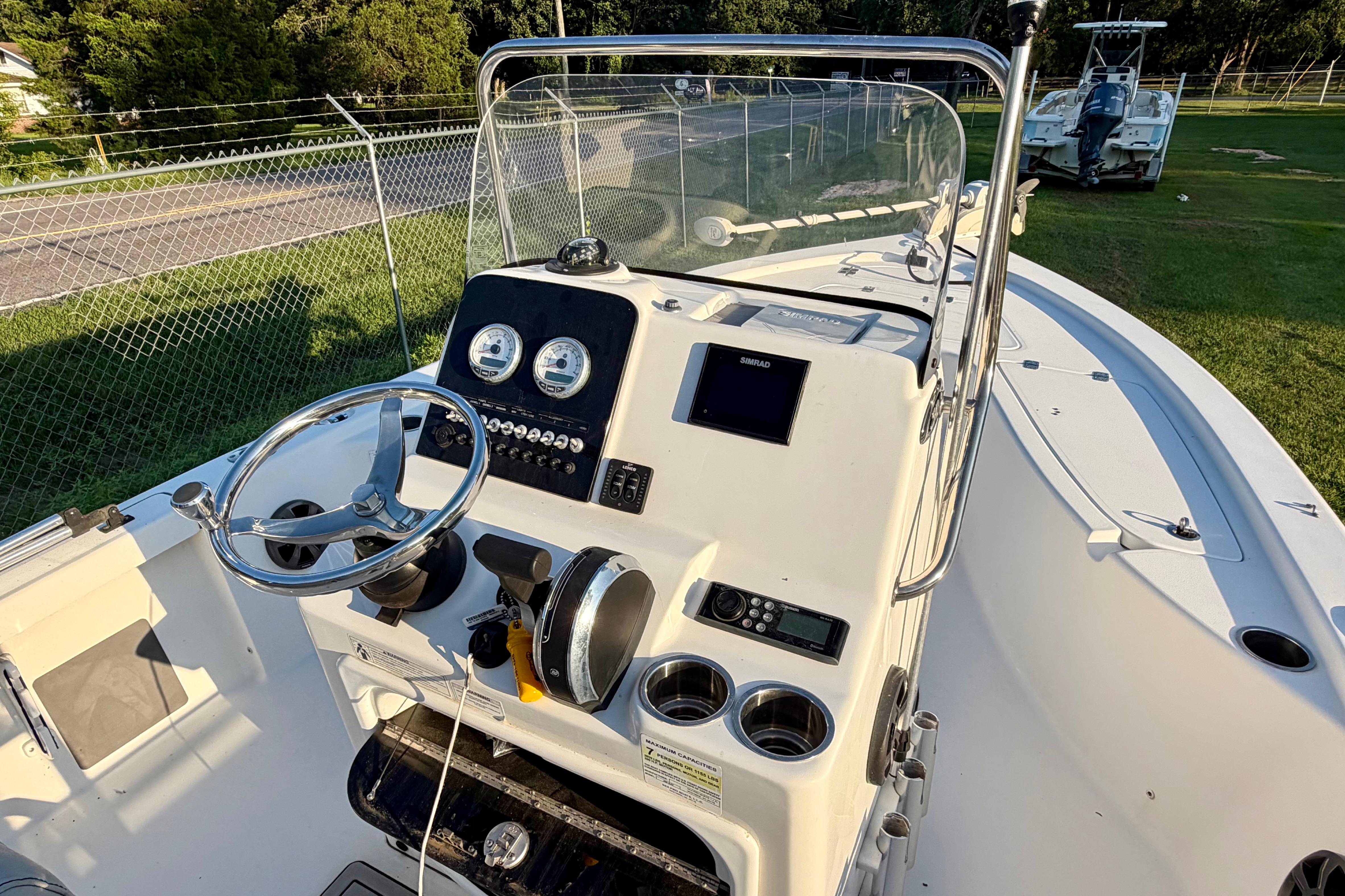 2018 Sea Pro 208 Bay boat dashboard with steering wheel and gauges.