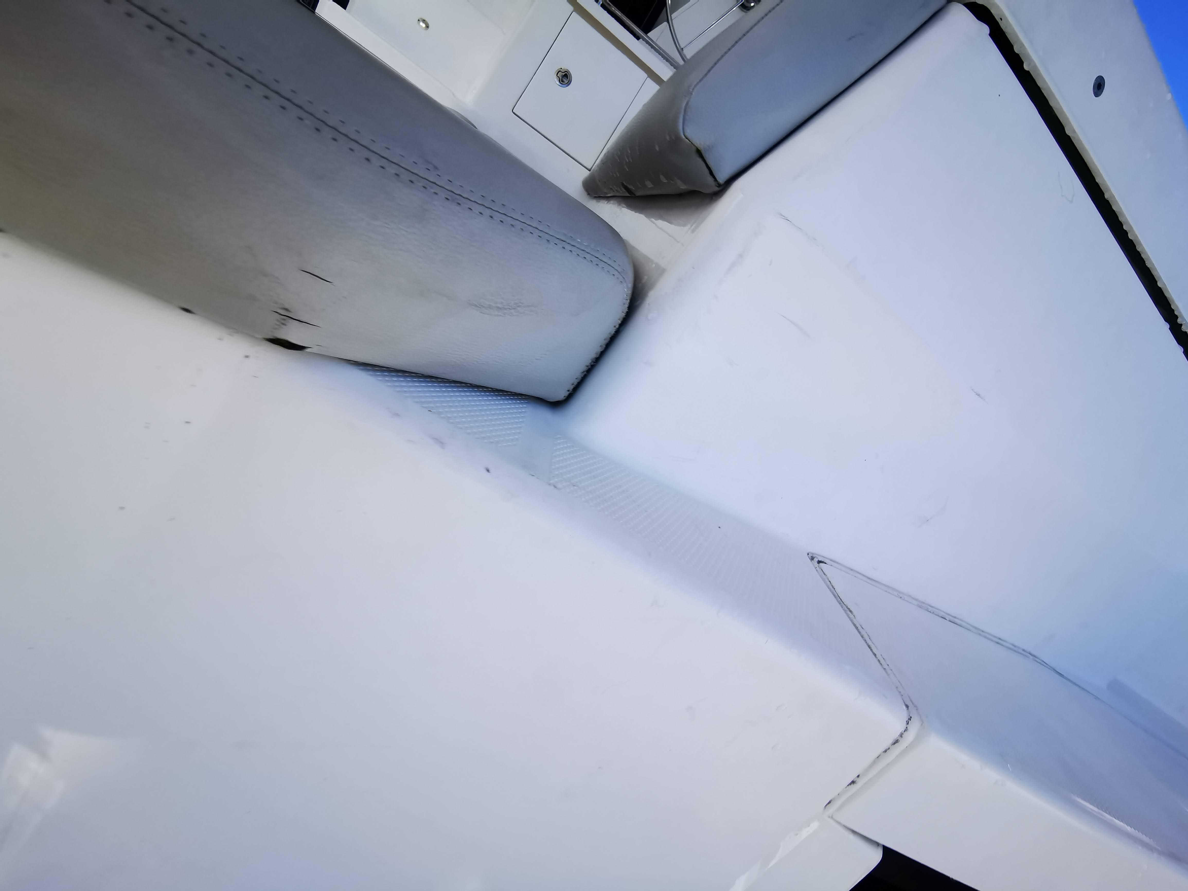 Close-up of a 2021 Leopard 50 yacht's sleek white exterior and seating area.