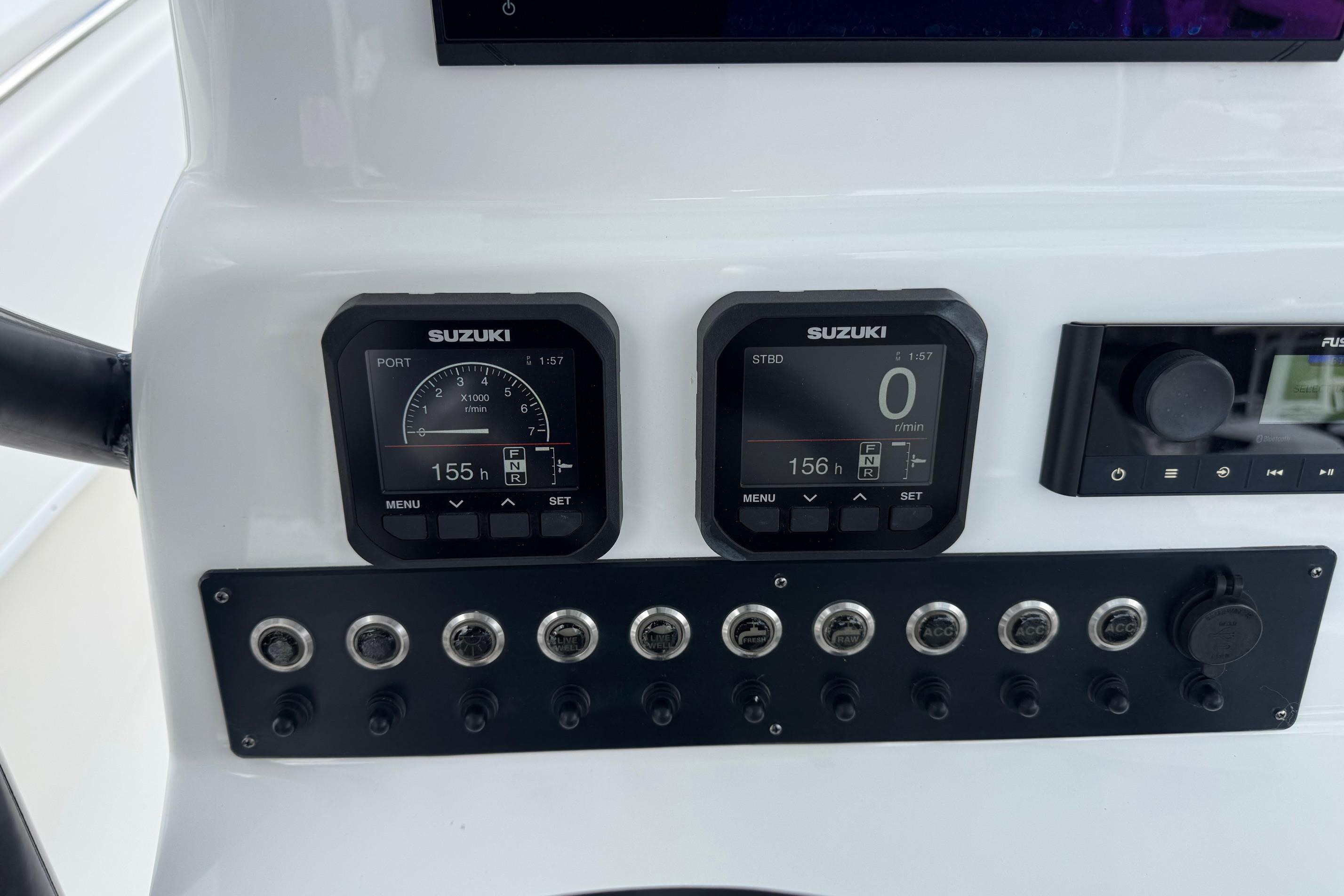 Dashboard of 2023 Cape Horn 24 XS boat with Suzuki gauges and controls.