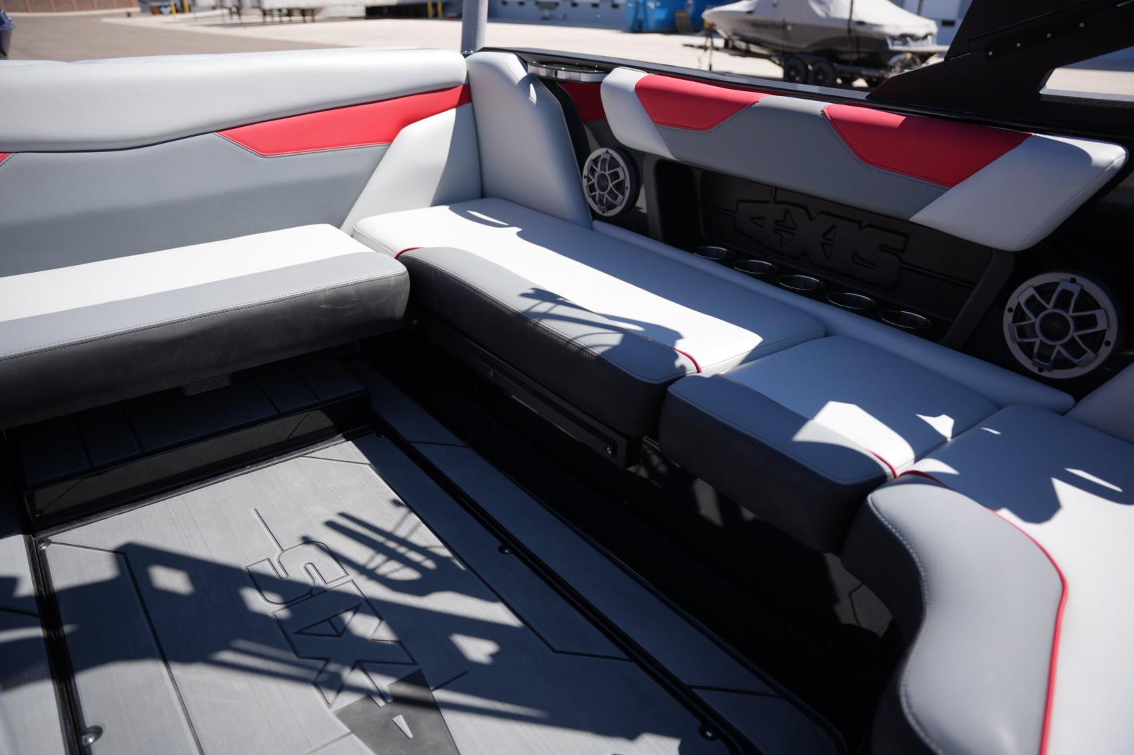 Interior of a 2019 Axis A22 boat with stylish seating and speaker system.