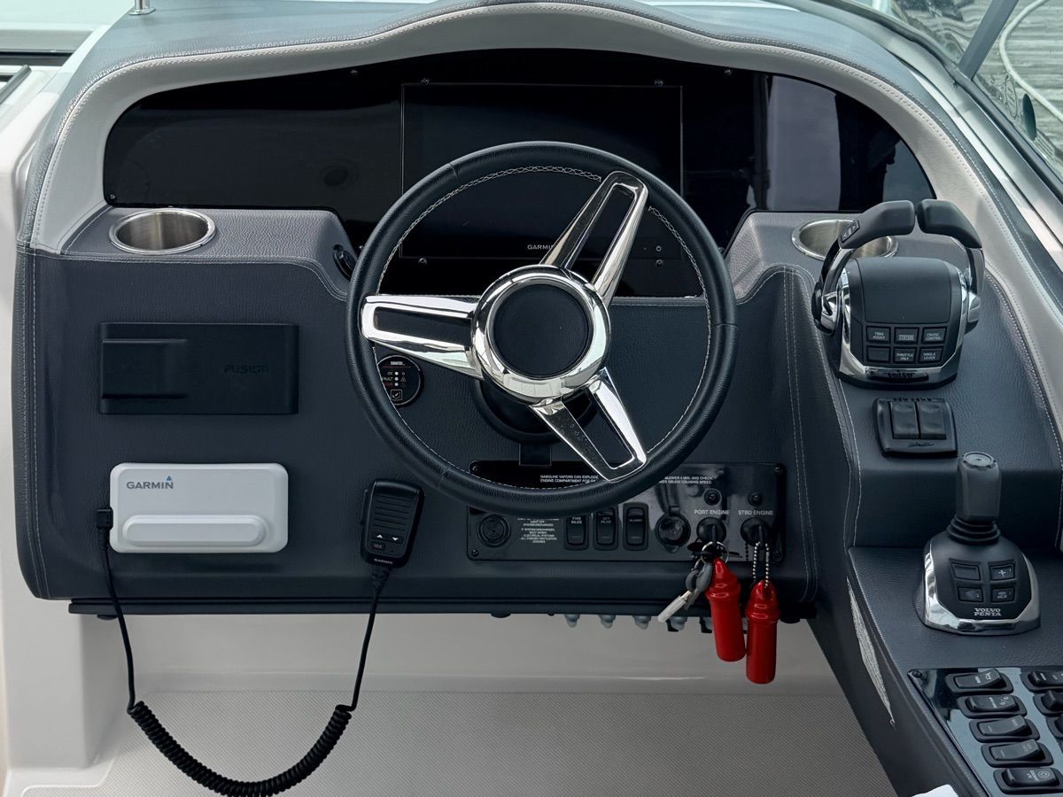 The image shows the helm of a Regal 33 Express boat with modern navigation instruments.