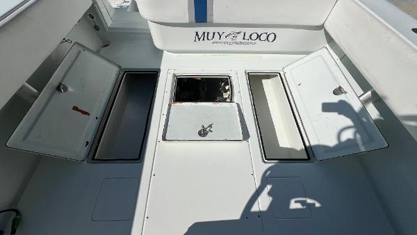2005 Contender 36 Open boat deck with open storage compartments.
