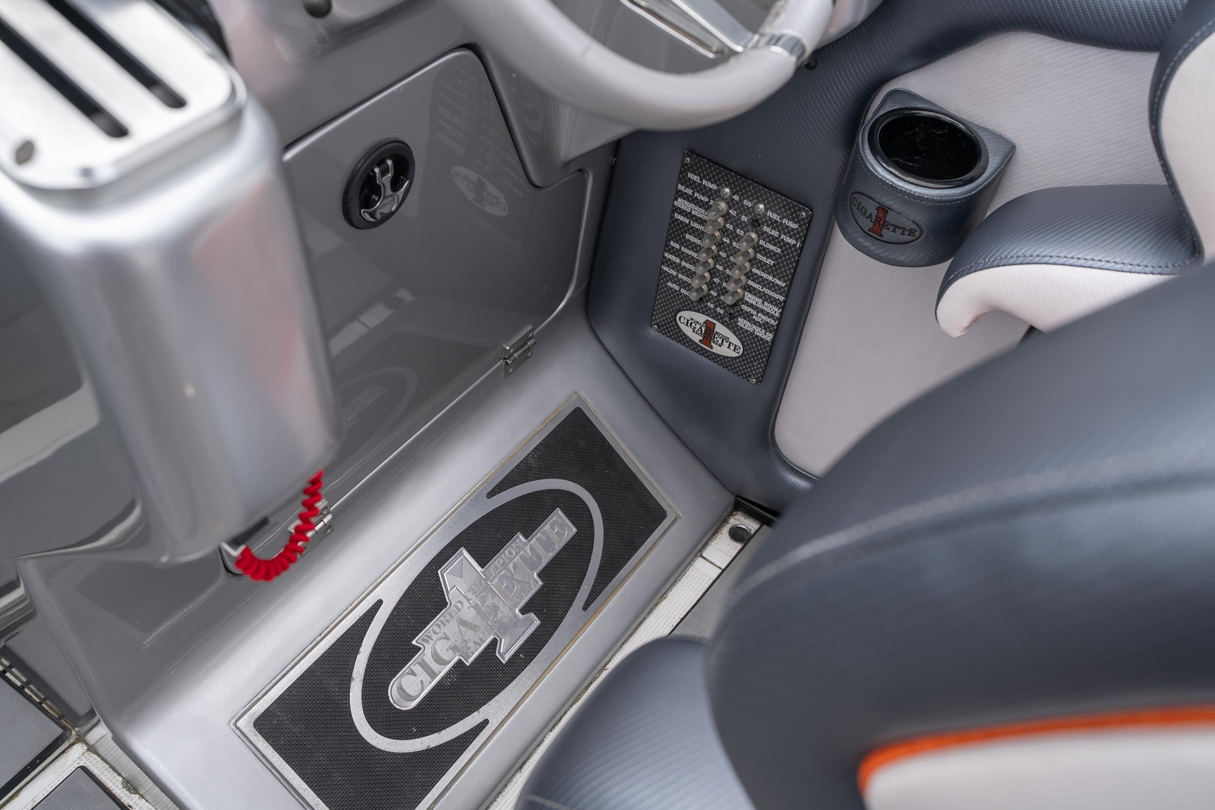 Interior of 2006 Cigarette 39' Top Gun Unlimited boat, featuring sleek design and branding.