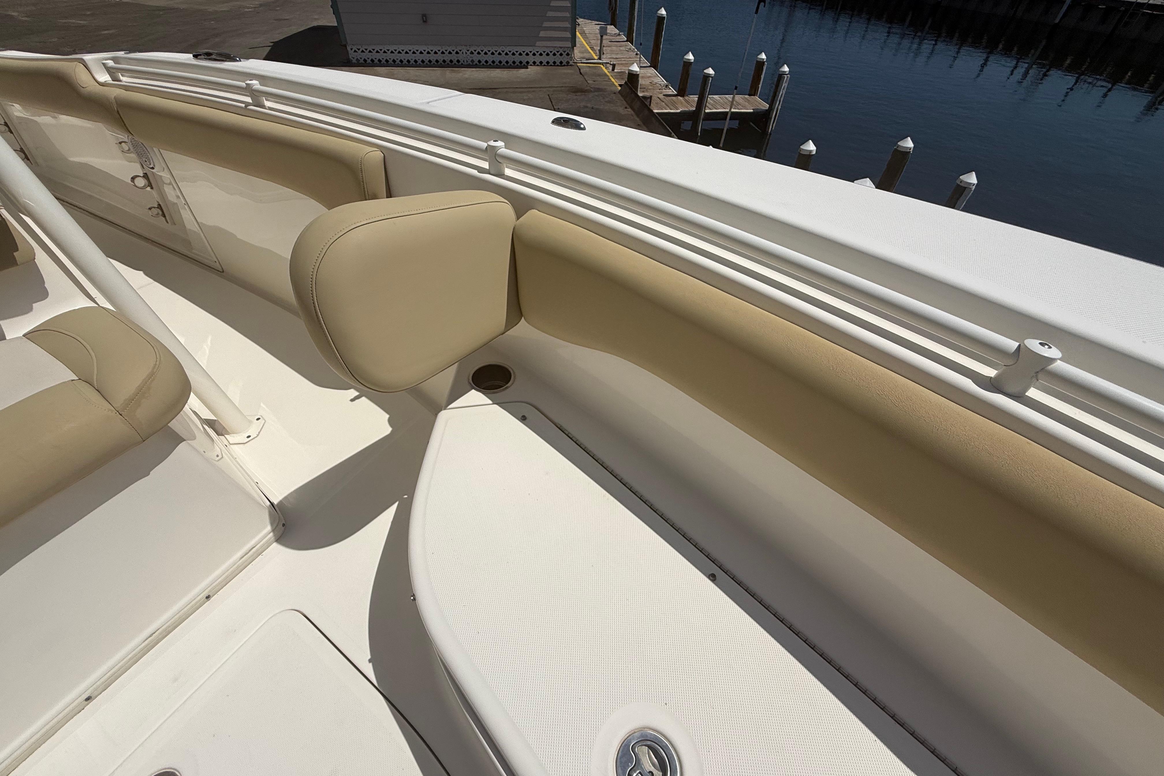 2019 Key West Billistic 281 Center Console boat interior with beige seating and white deck.