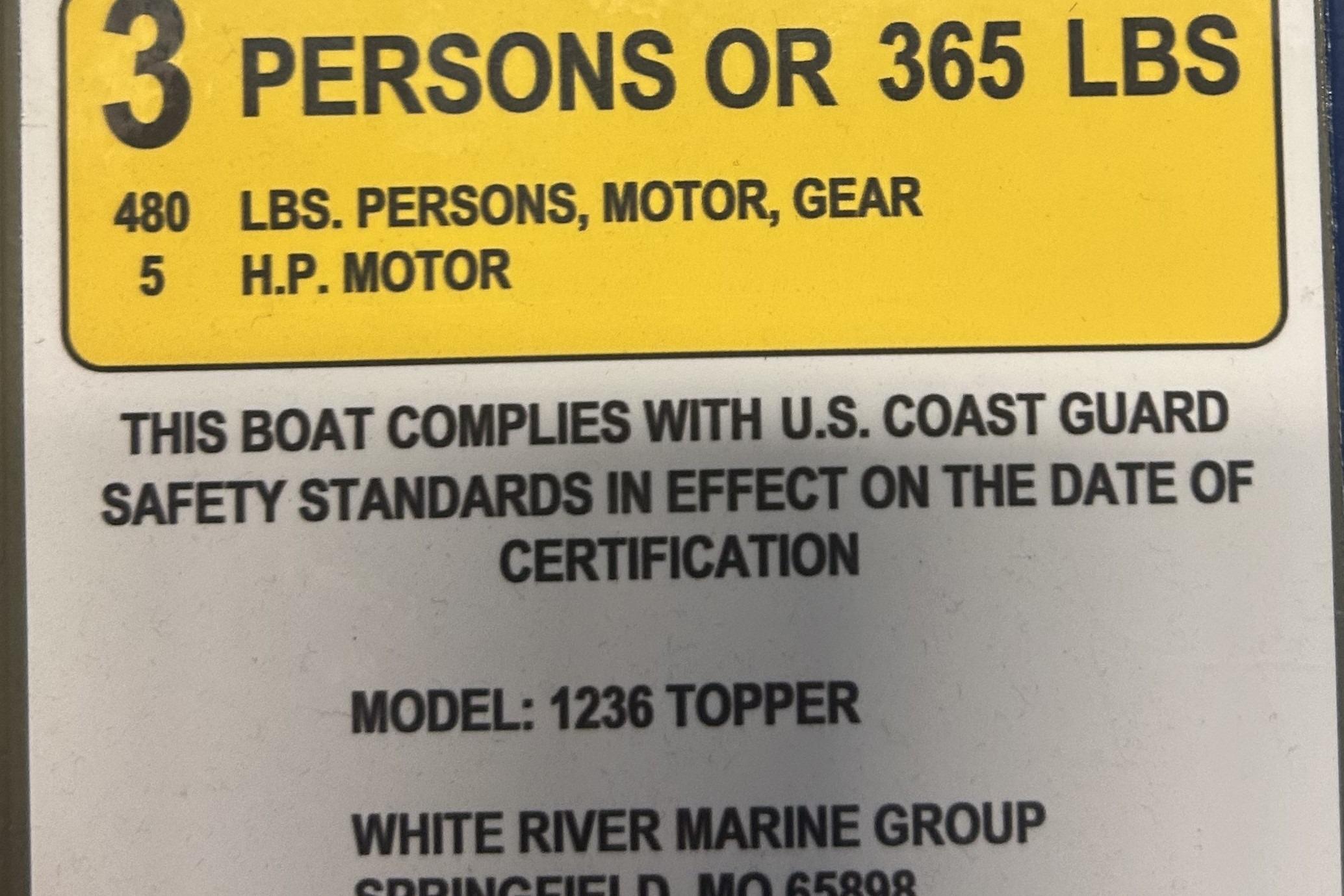 Capacity label for 2026 Tracker Grizzly 12 Jon boat, 3 persons or 365 lbs, 5 HP motor.