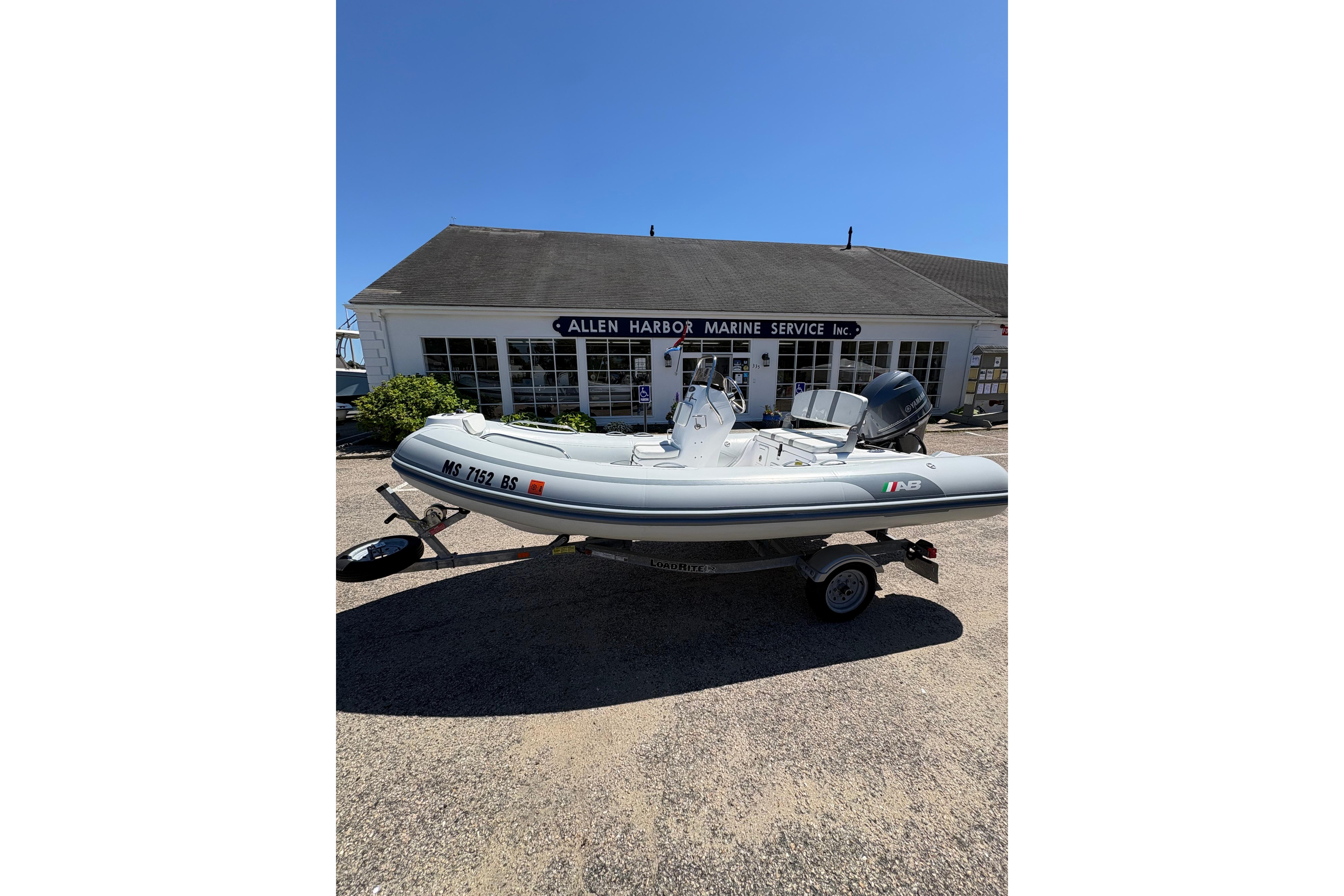 2022 AB Inflatables Oceanus 14 VST boat on trailer at marine service center.