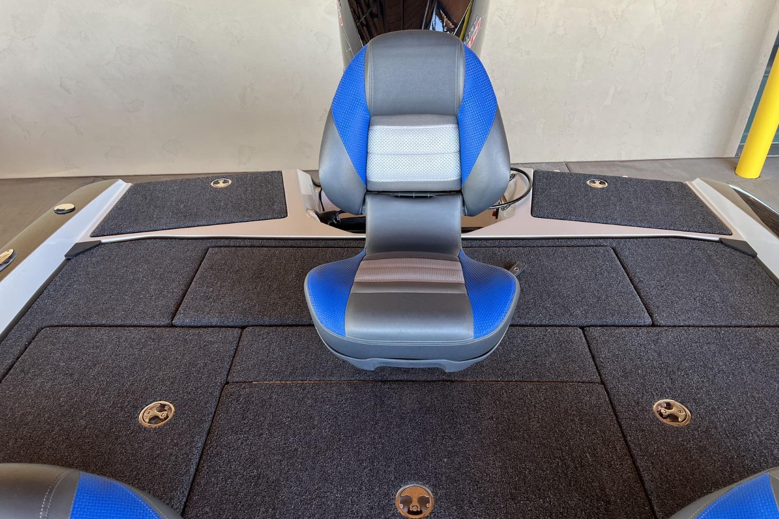 2025 Ranger 212LS boat interior with blue and gray seating and carpeted flooring.