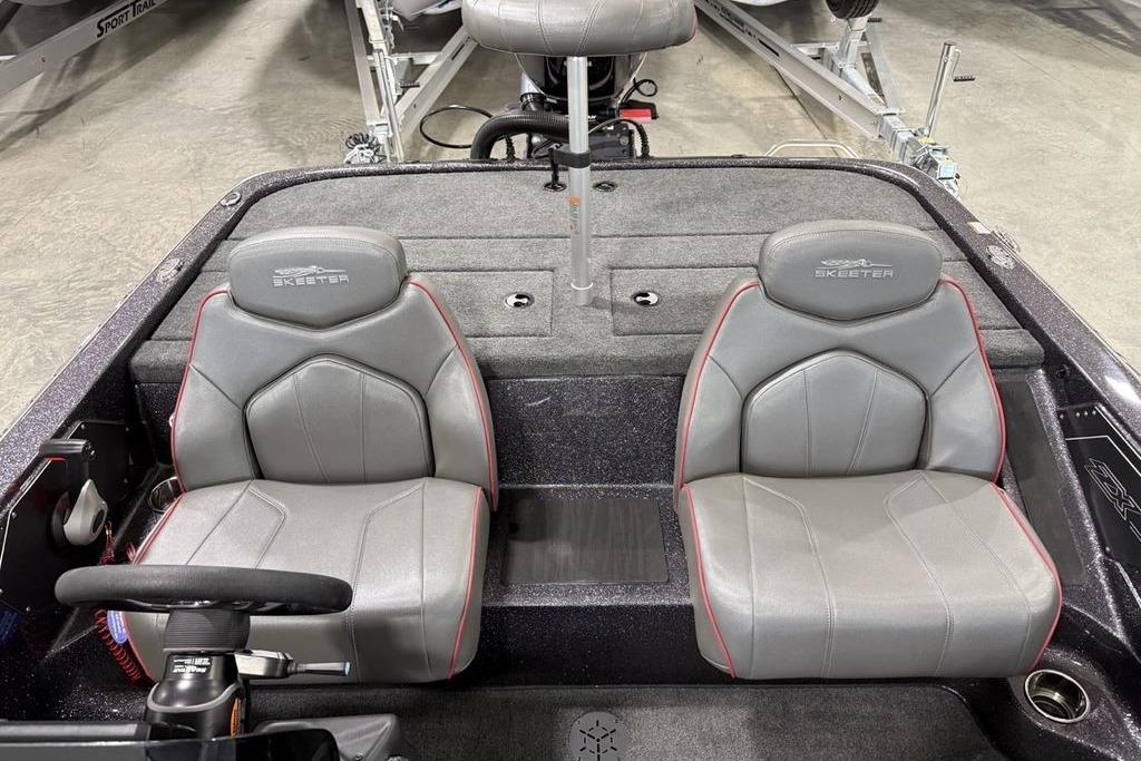 2025 Skeeter ZX150 boat interior with two gray seats and steering wheel.