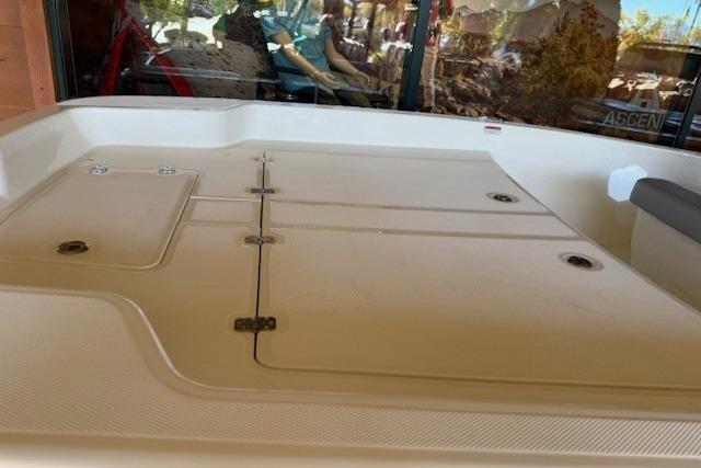 2026 Mako Pro Skiff 17 CC boat deck with storage compartments.
