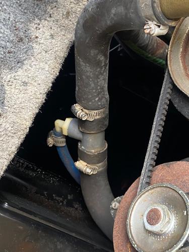 Close-up of 1998 Malibu Response engine hoses and belt system.