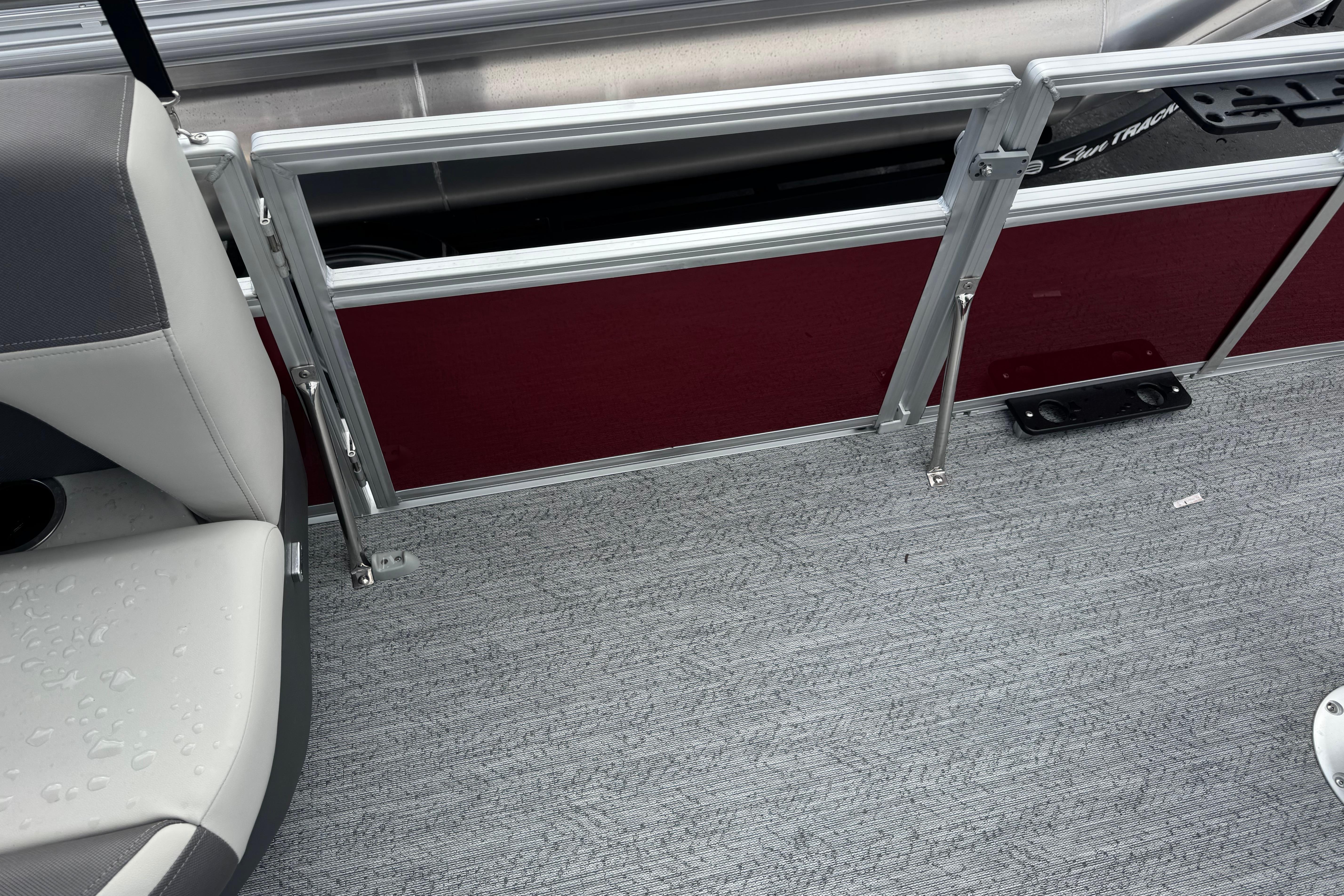 Interior view of 2026 Sun Tracker Bass Buggy 16 XL Select pontoon boat with seating and railing.