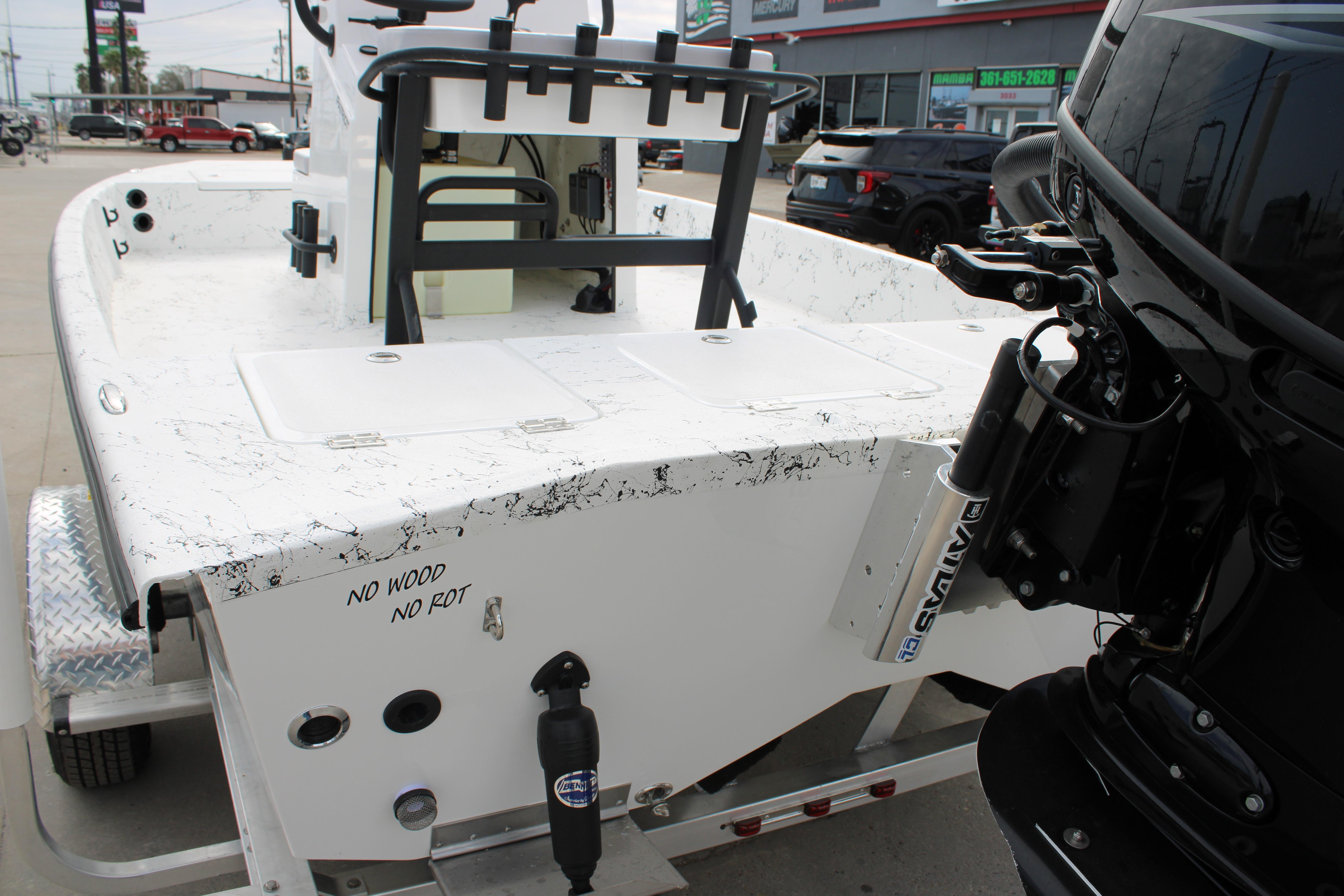 2026 Freedom Boats 19 PATRIOT, rear view, showcasing motor and "No Wood No Rot" feature.