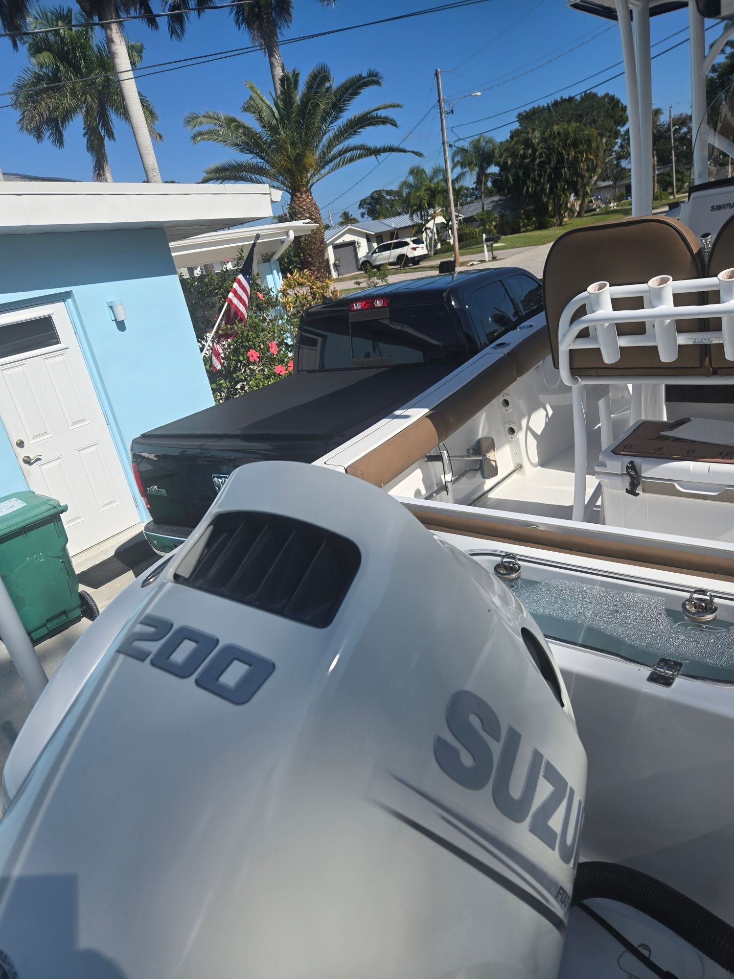 2018 Sea Pro 21.9 boat with Suzuki 200 engine in driveway.