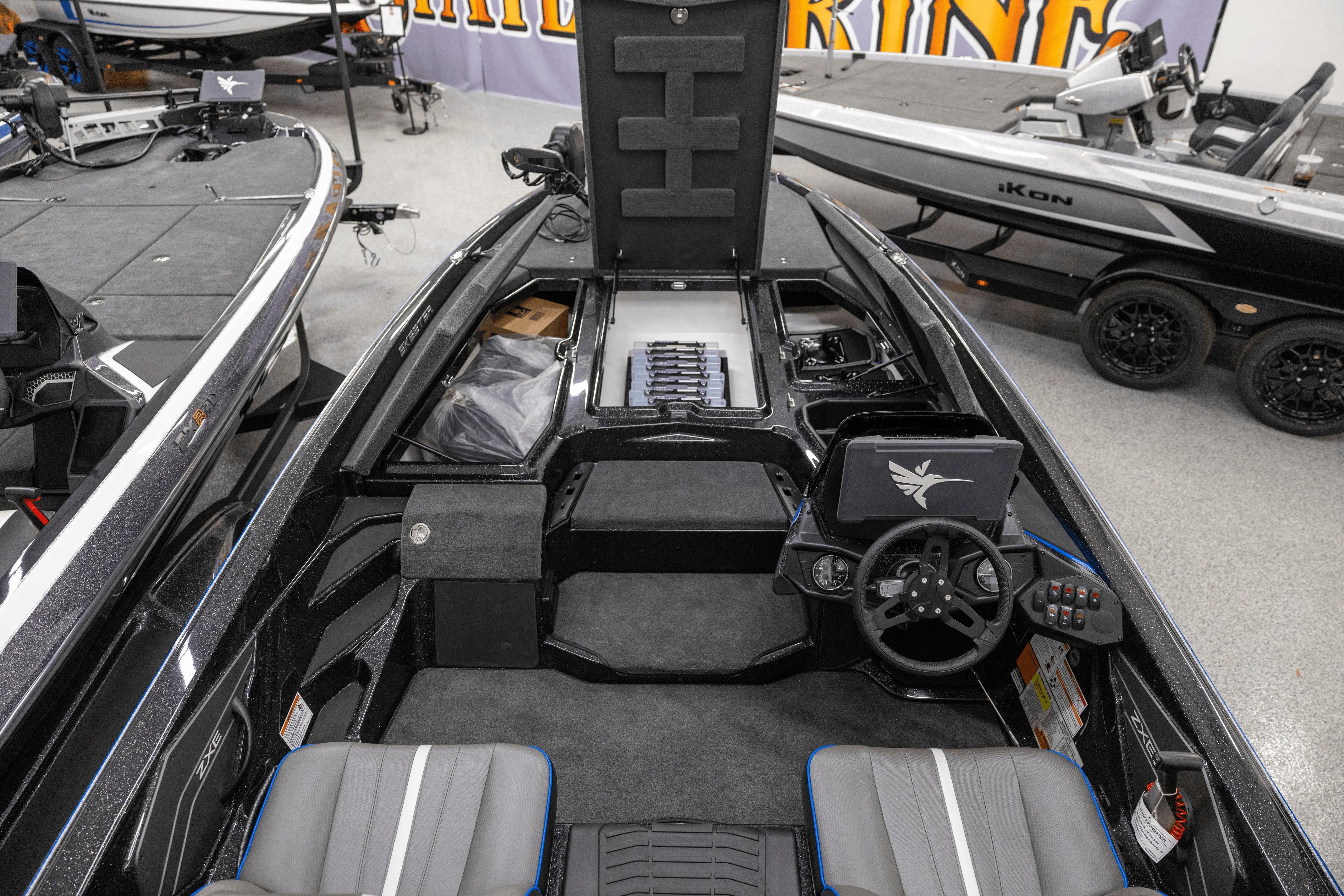 2026 Skeeter ZXE21 boat interior with steering wheel and storage compartments.