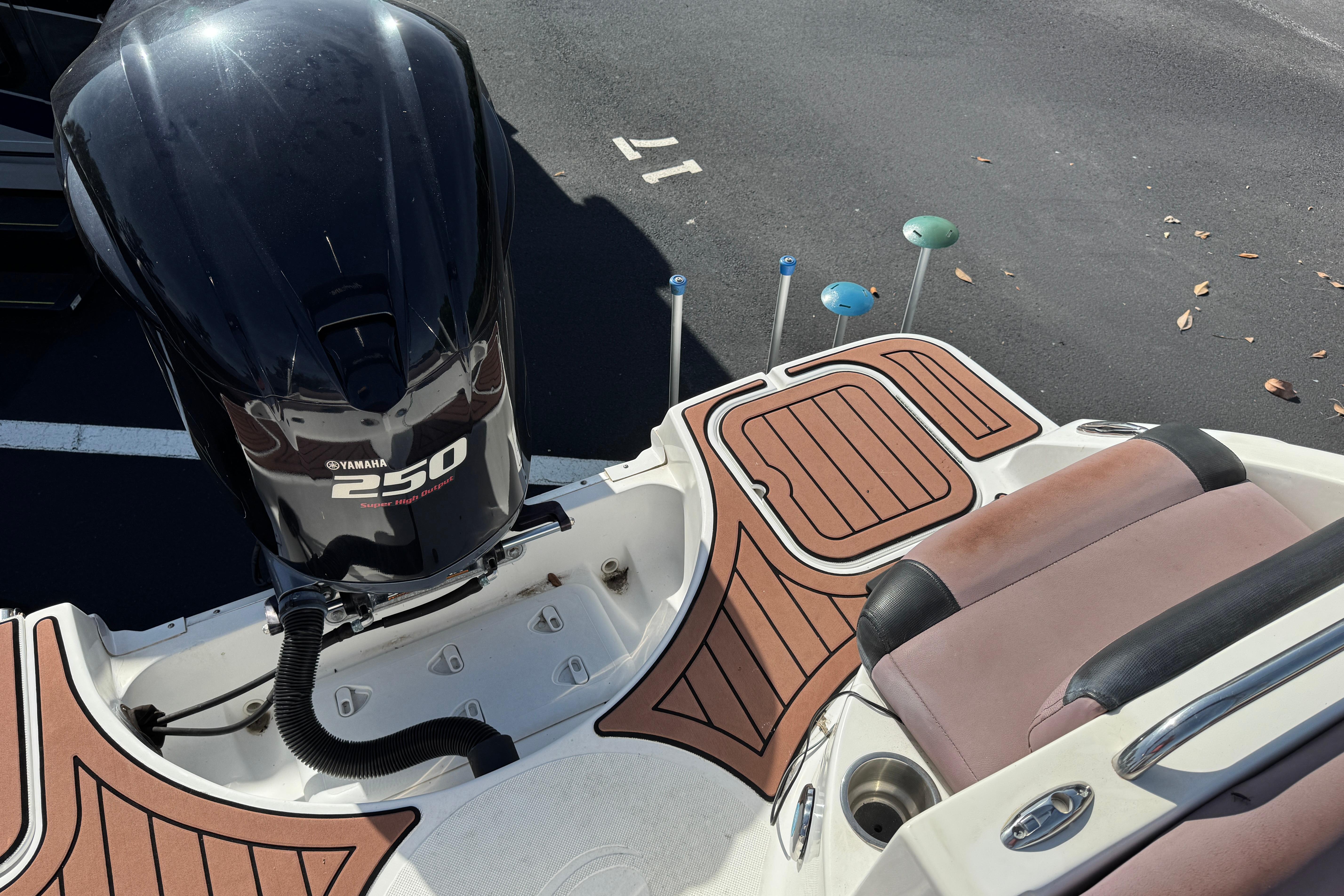 2018 Hurricane SunDeck 2400 OB with Yamaha 250 outboard motor, featuring teak-style decking.