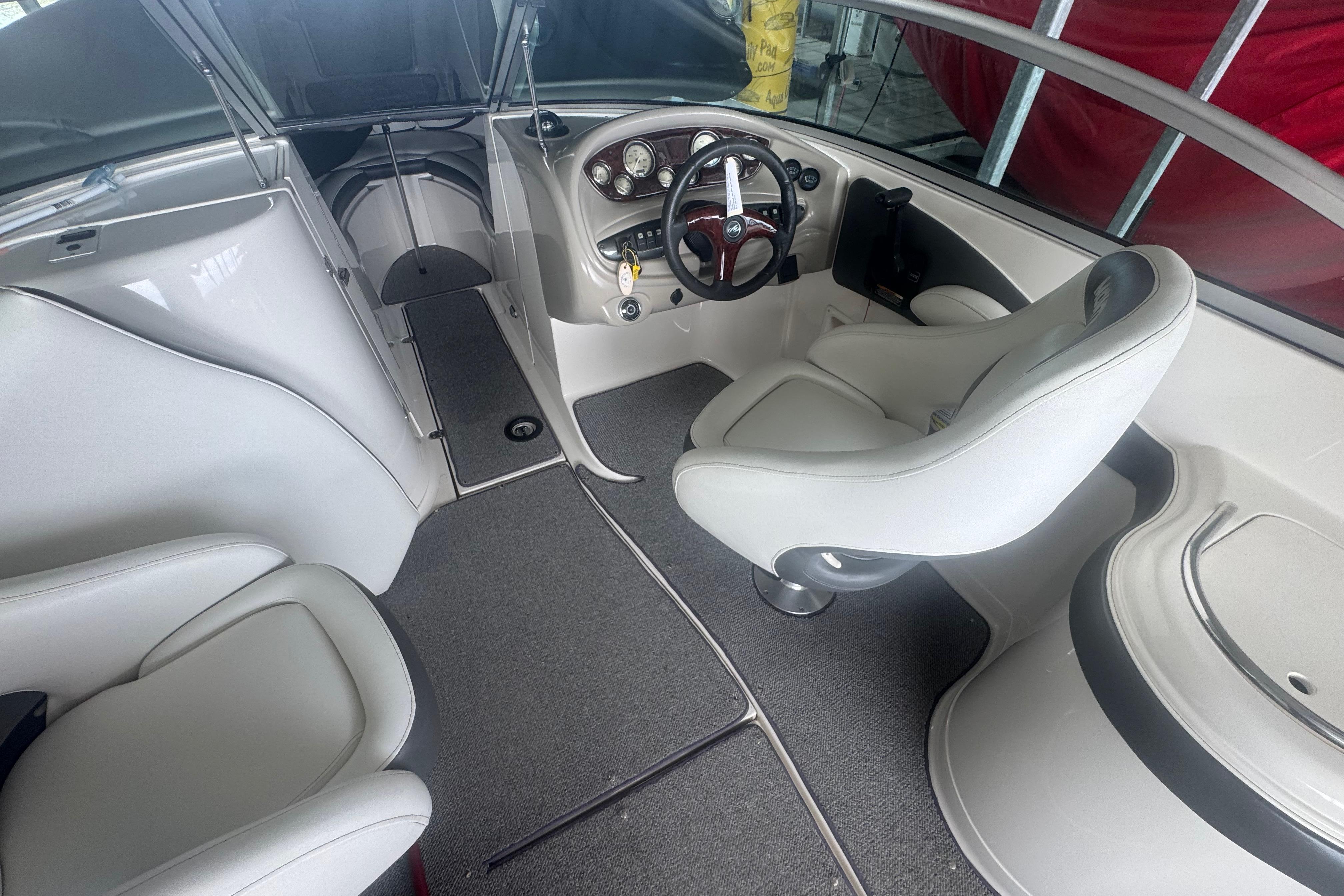 2005 Monterey 248LS Montura Bowrider interior with steering wheel and seating.