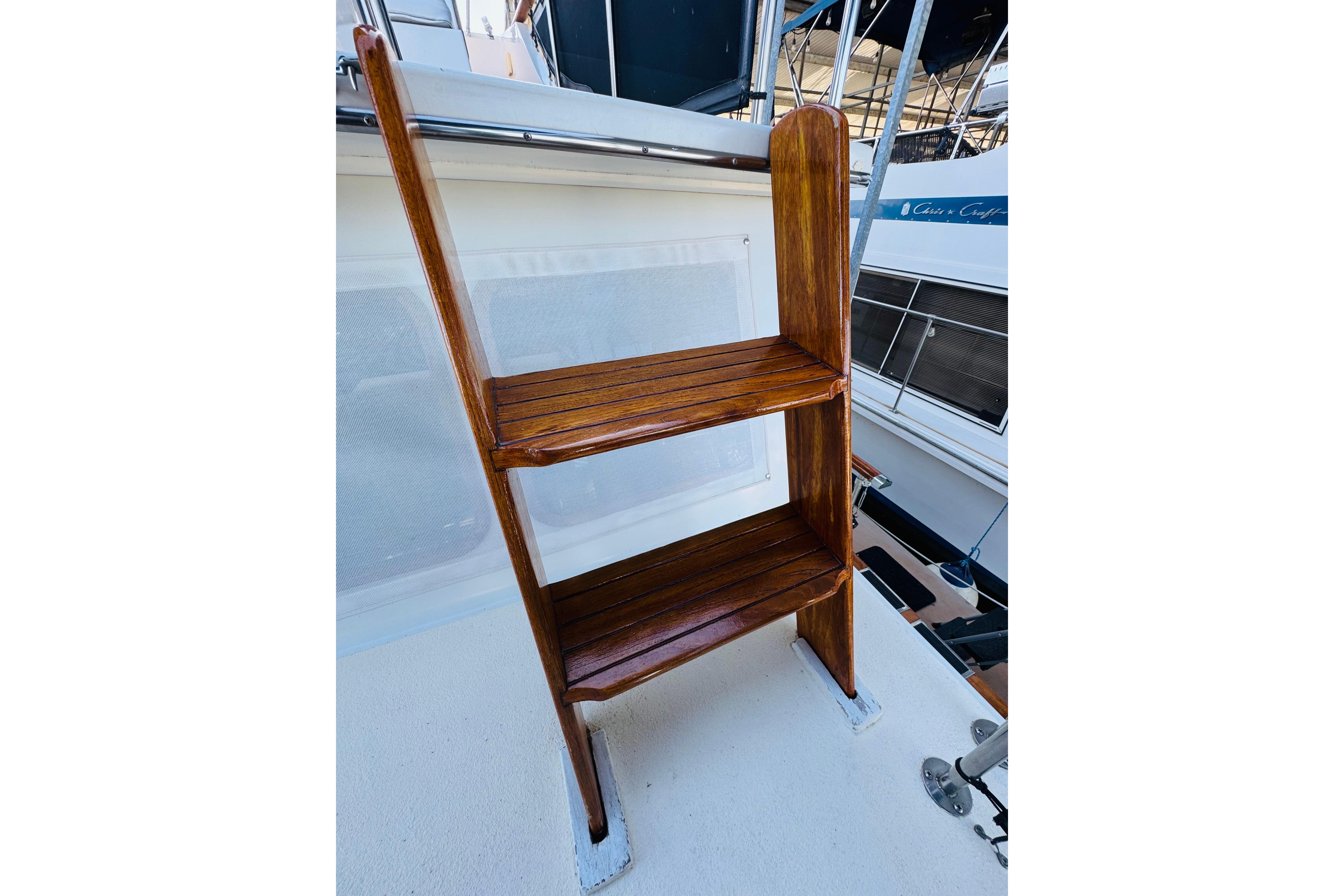 Wooden ladder on 1978 Californian 42 LRC boat deck, showcasing craftsmanship and design.