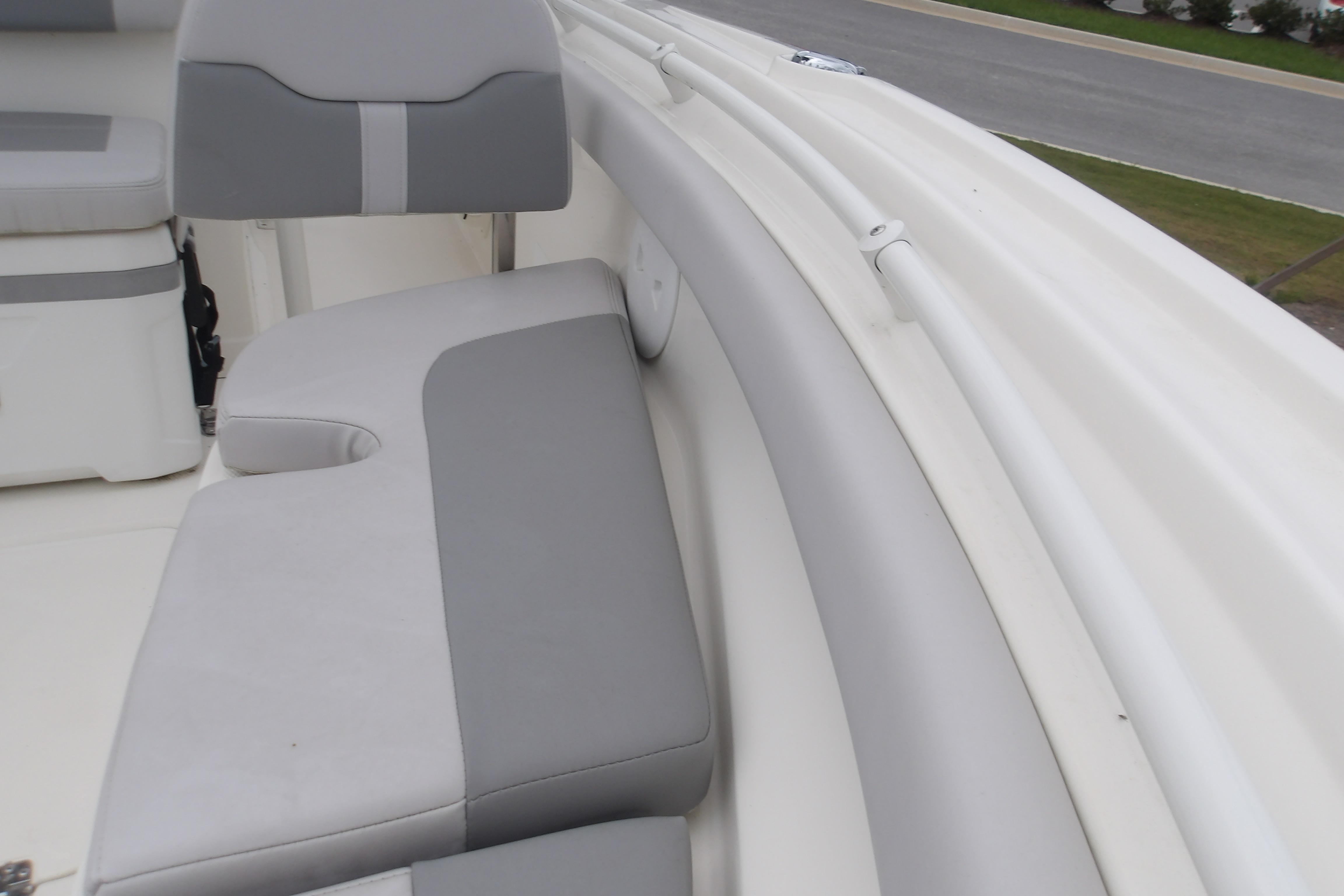 2025 Mako 214 Center Console boat interior with gray and white seating.