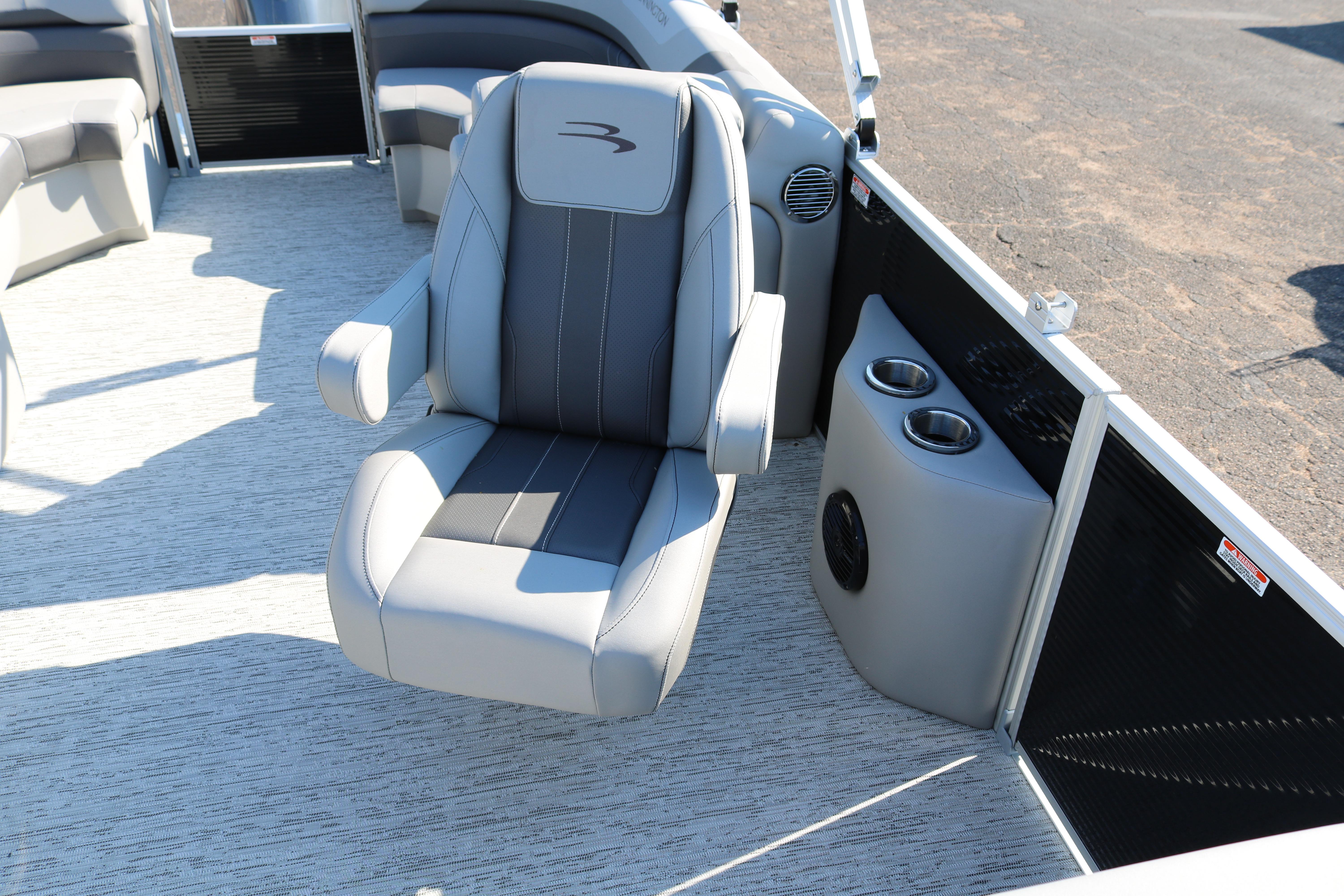 Luxury seating on 2026 Bennington 22SX Stern Radius pontoon boat with cup holders.