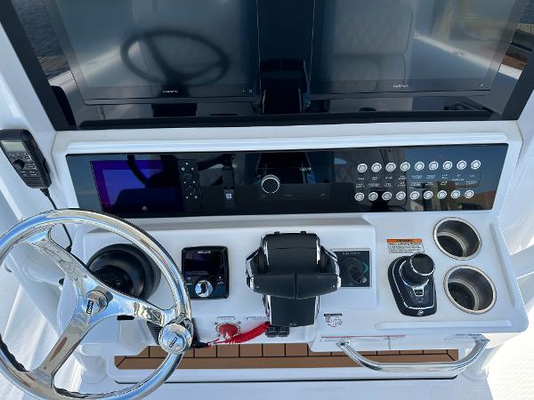 Control panel of 2025 Southport 33 FE boat with steering wheel and navigation instruments.