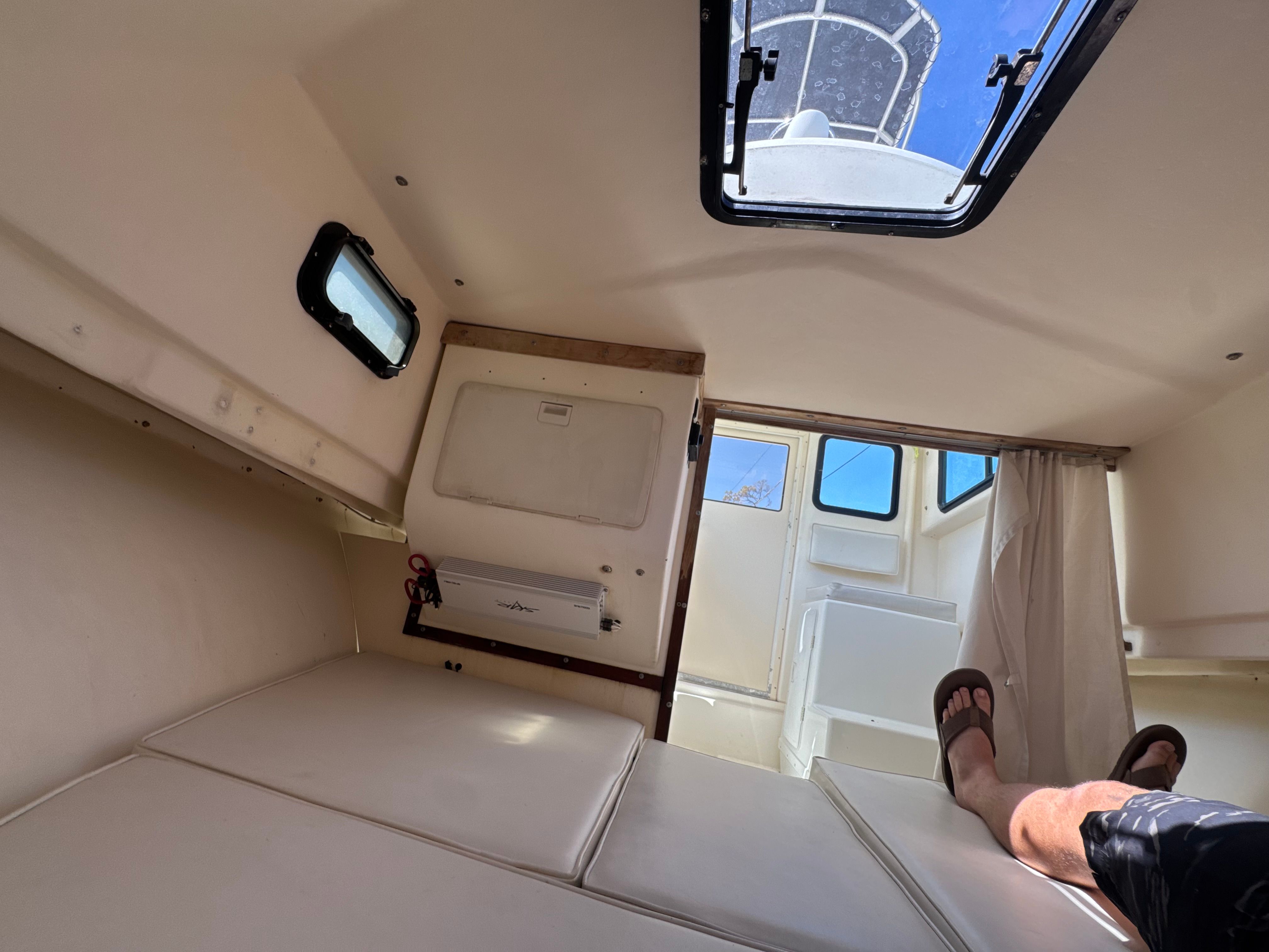 Interior of a 1997 Parker 2520 boat with lounging area.
