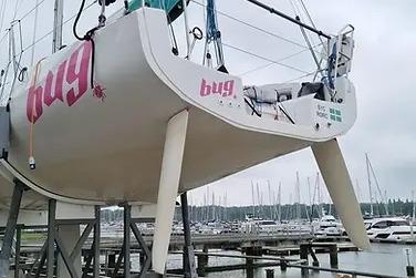 2021 Jeanneau Sun Fast 3300 sailboat on dry dock at marina.