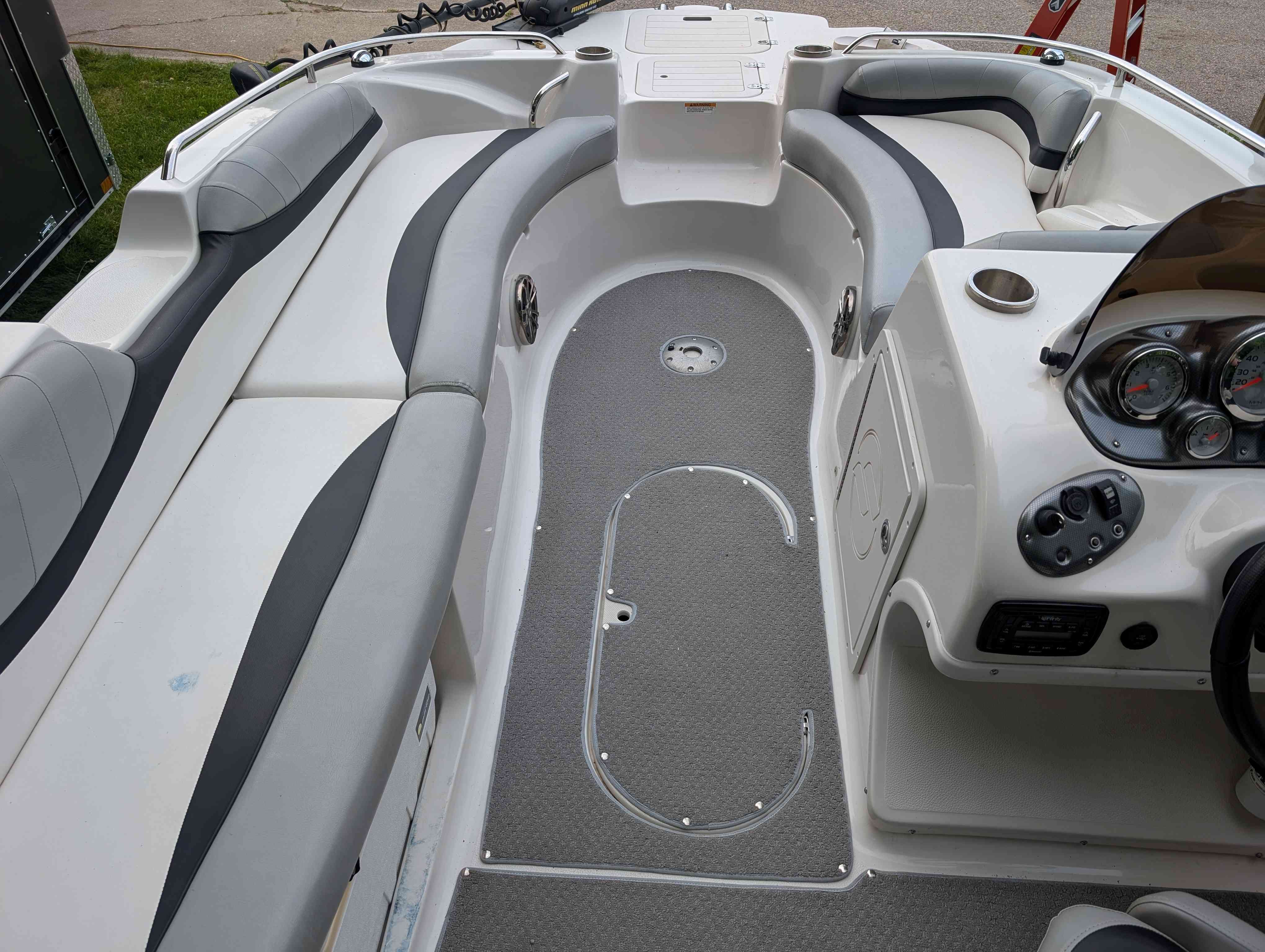 Interior of a 2015 Starcraft 2000 boat with gray seating.