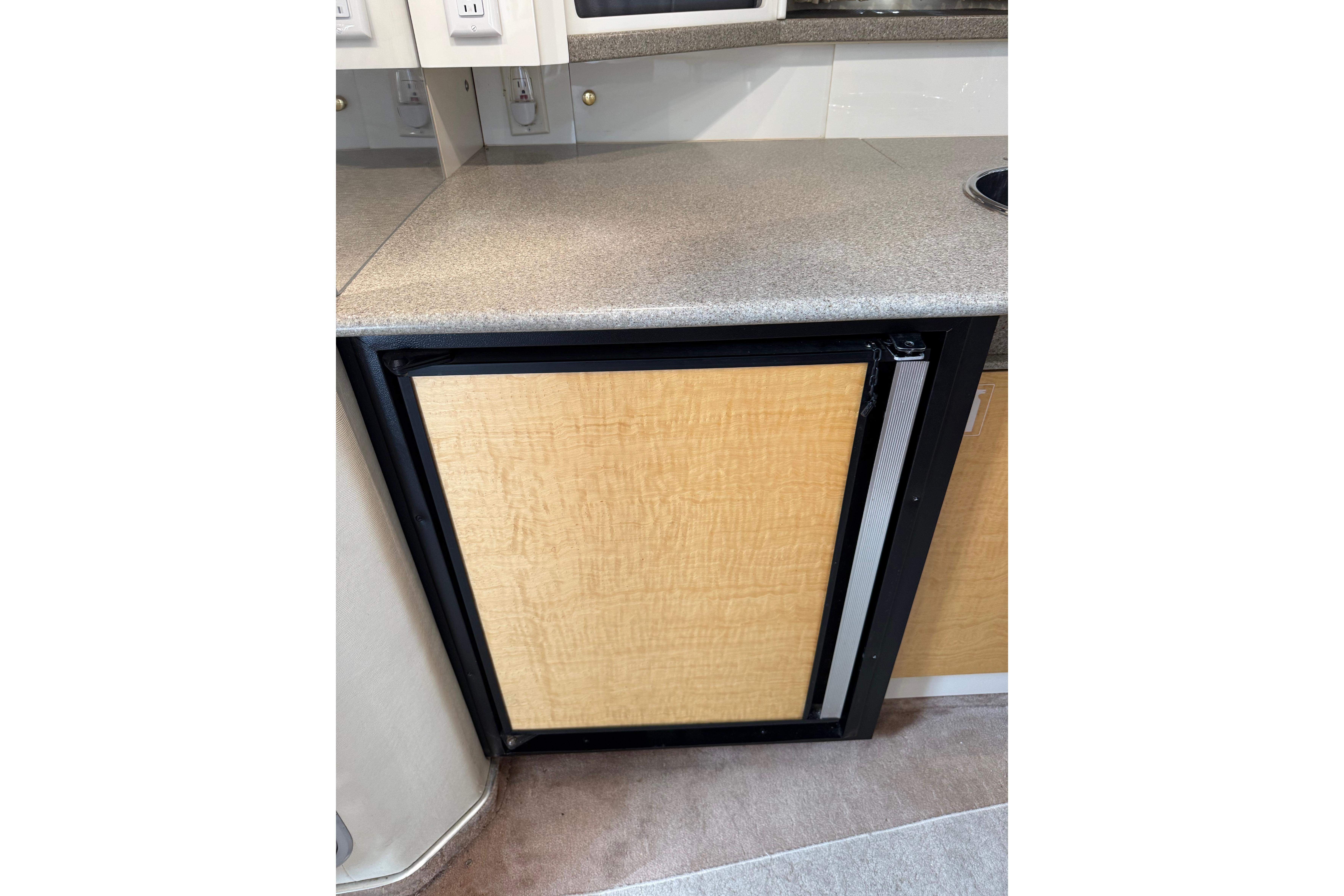 1999 Formula 34 Performance Cruiser interior with wooden cabinet and countertop.