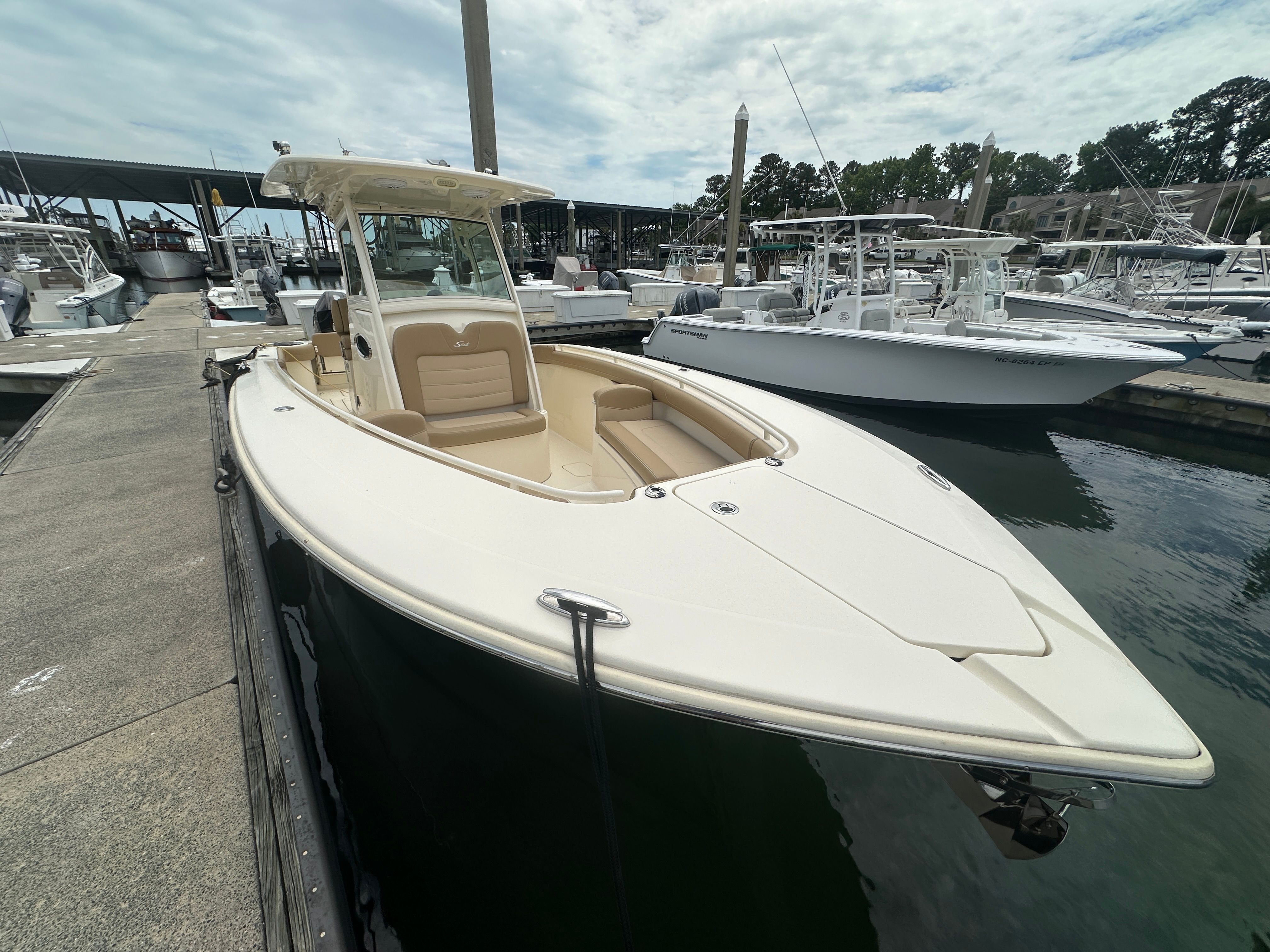 2019 Scout 275 LXF boat docked at marina.