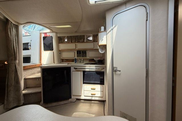 Interior of 1994 Sea Ray Sundancer 370 yacht with kitchenette.
