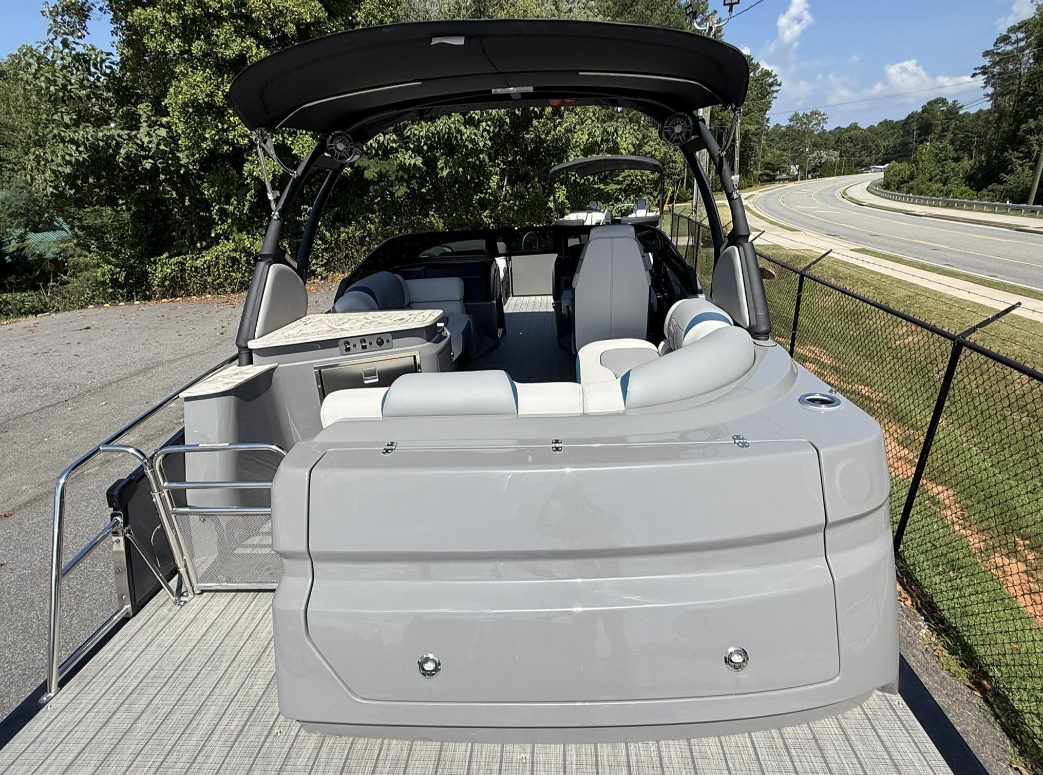 2025 Tahoe Pontoon Grand Tahoe Elite Windshield, rear view, parked on a sunny day.