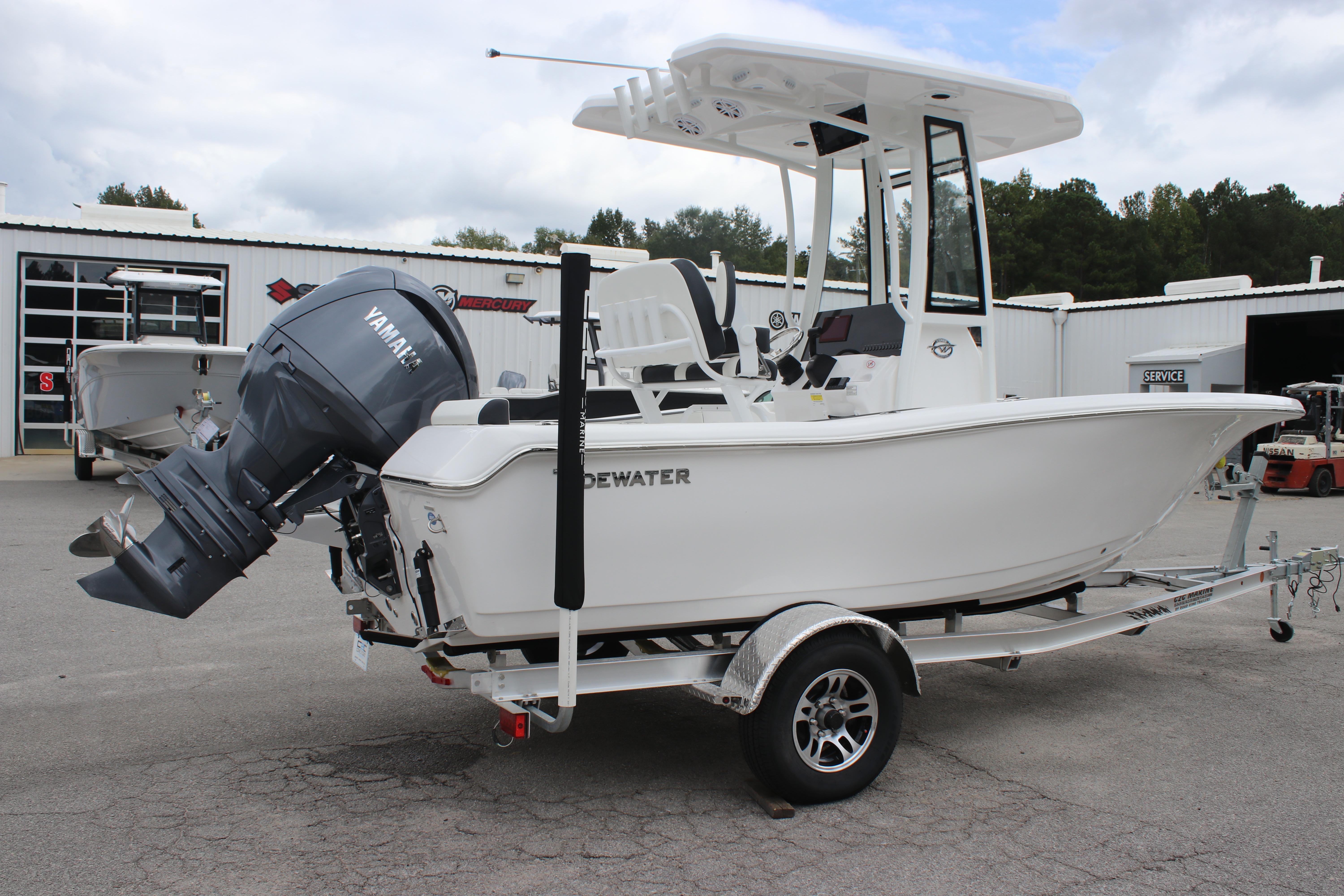 2026 Tidewater 198 CC Adventure boat with Yamaha engine on trailer, parked outdoors.