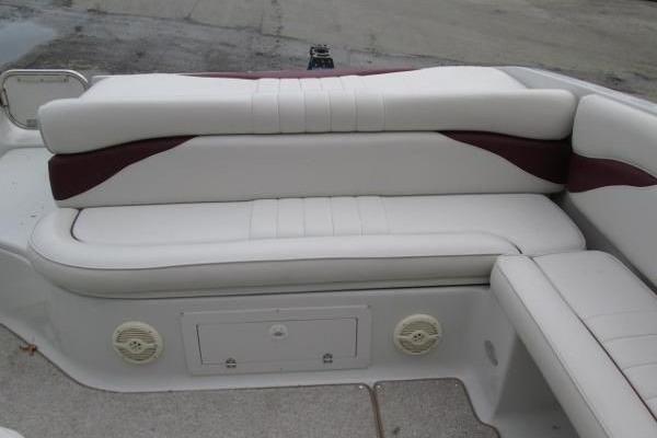 2004 Crownline 288 BR boat interior with white and maroon seating.