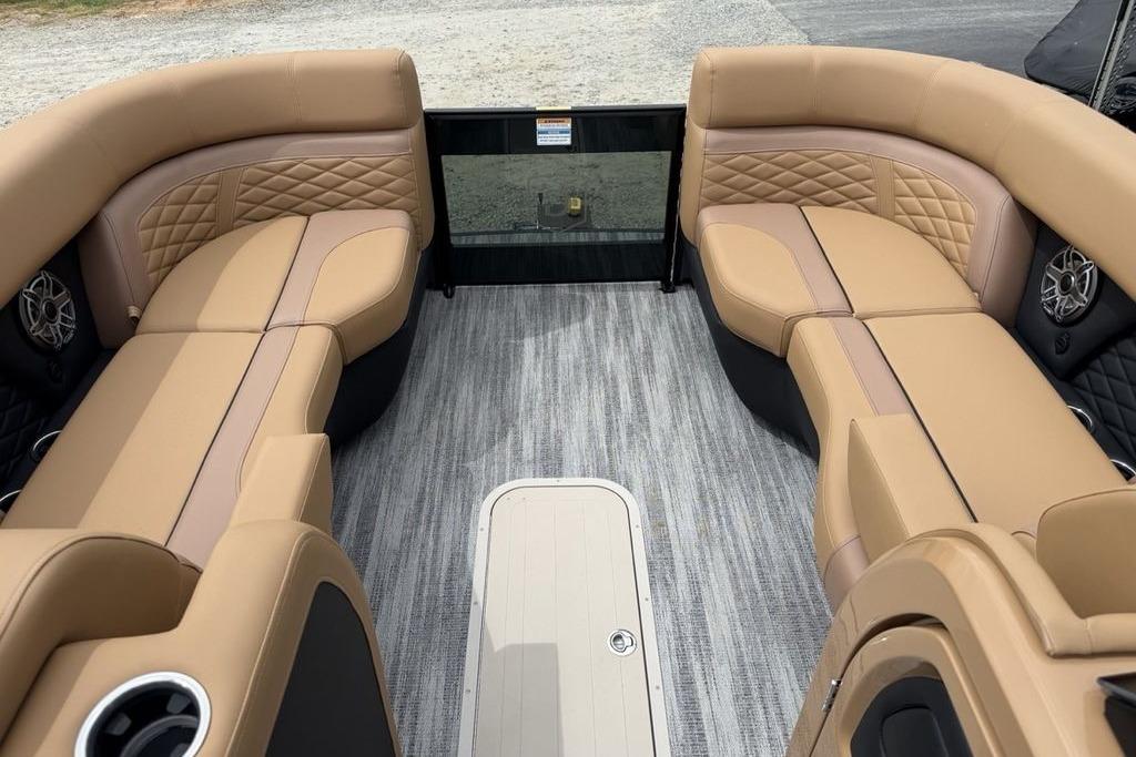 Luxurious interior of 2026 Godfrey Monaco 235 SFLC iMPACT pontoon boat with tan seating.