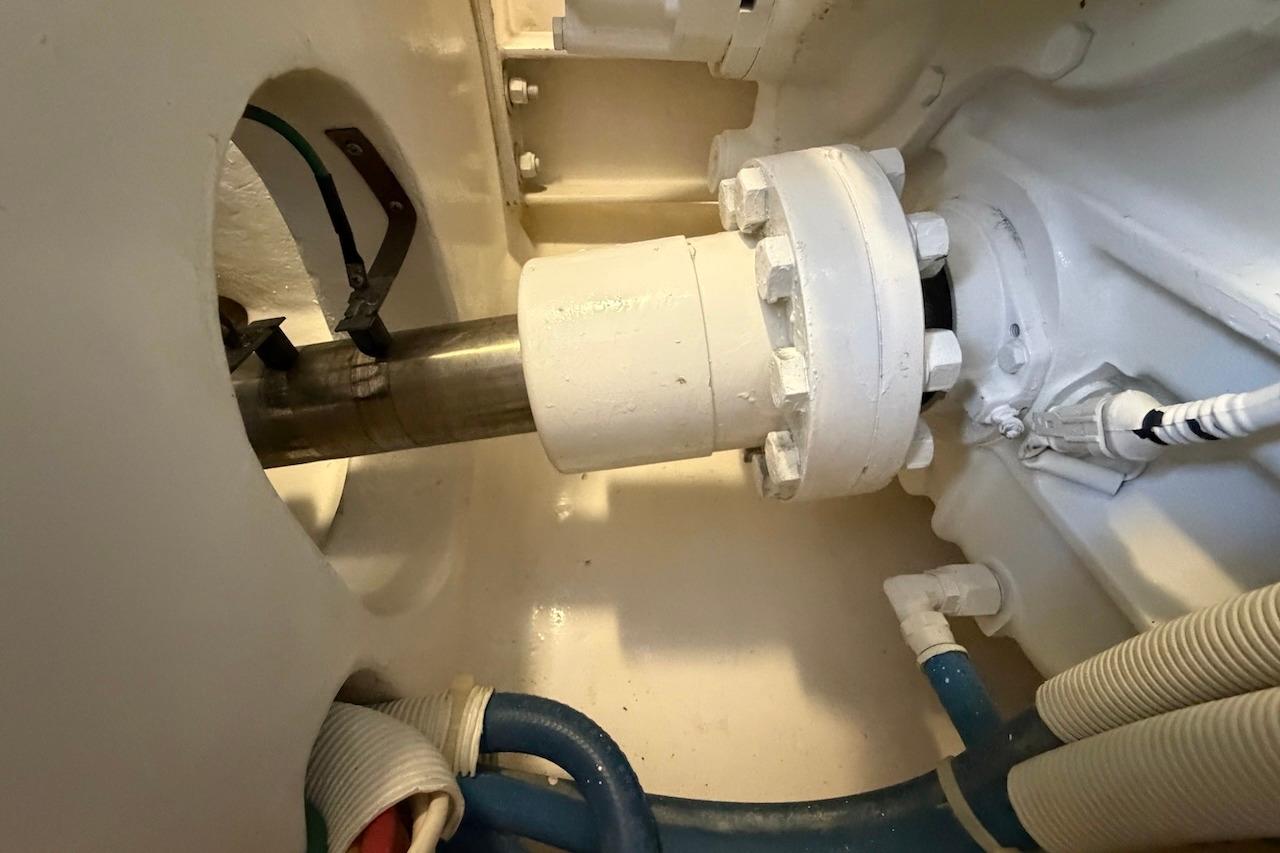 Engine room detail of a 2012 Viking 50 Convertible yacht, showcasing mechanical components.