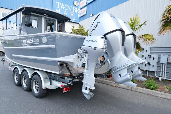 2024 Hewescraft 250 Explorer boat with dual Honda outboard motors on a trailer.