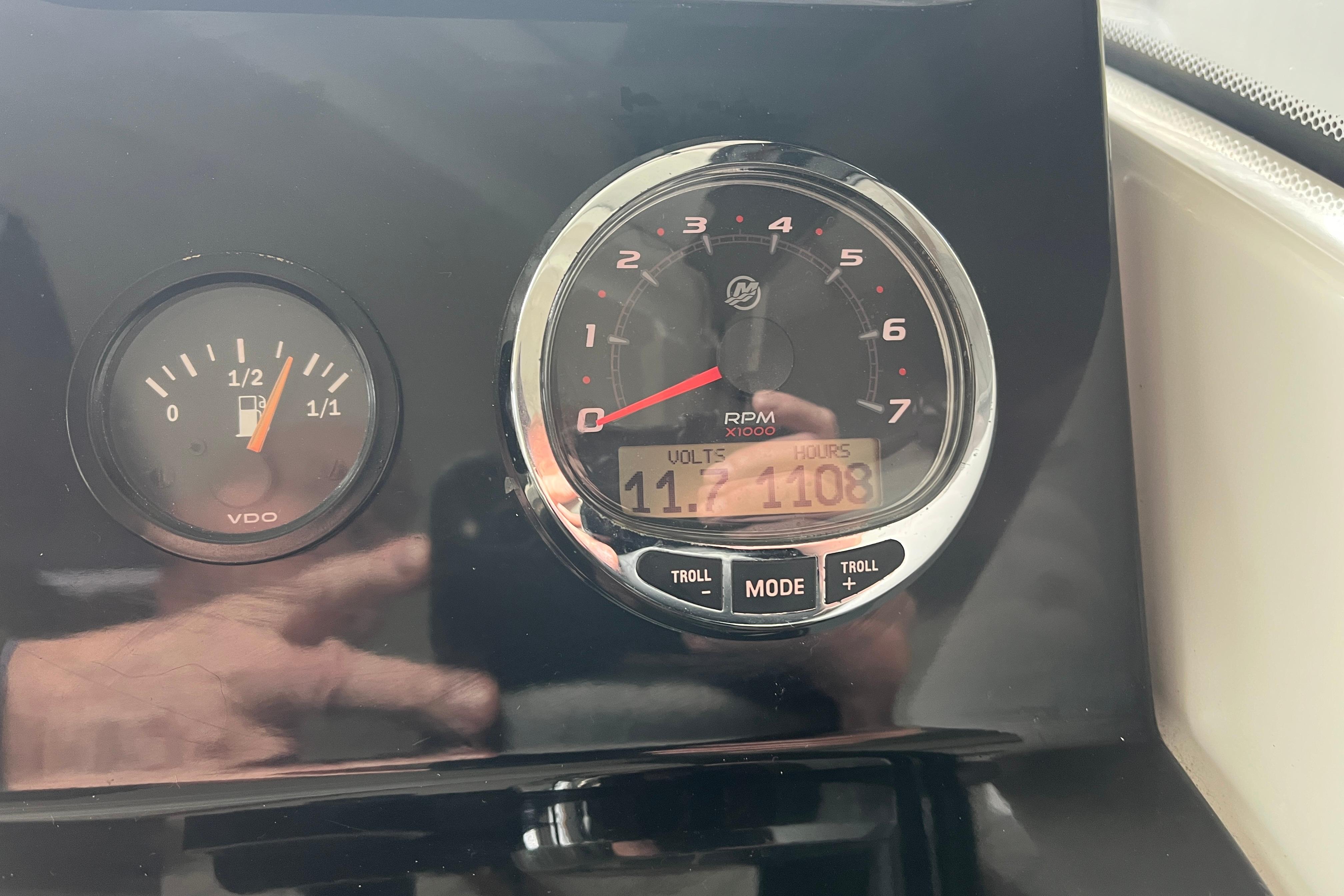 Dashboard of 2022 Jeanneau NC Weekender 695 Series 2 showing fuel and RPM gauges.