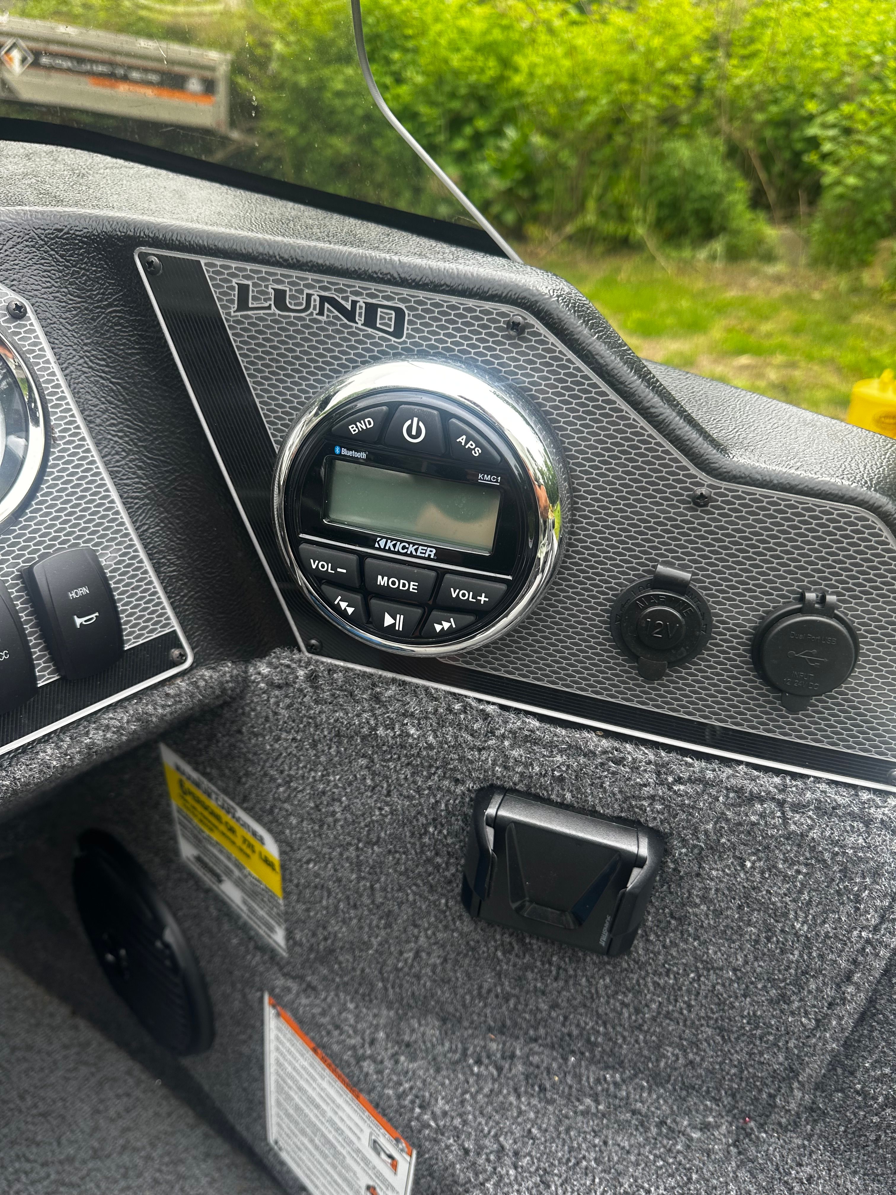 Dashboard of 2025 Lund 1775 Adventure SS with Kicker stereo system.