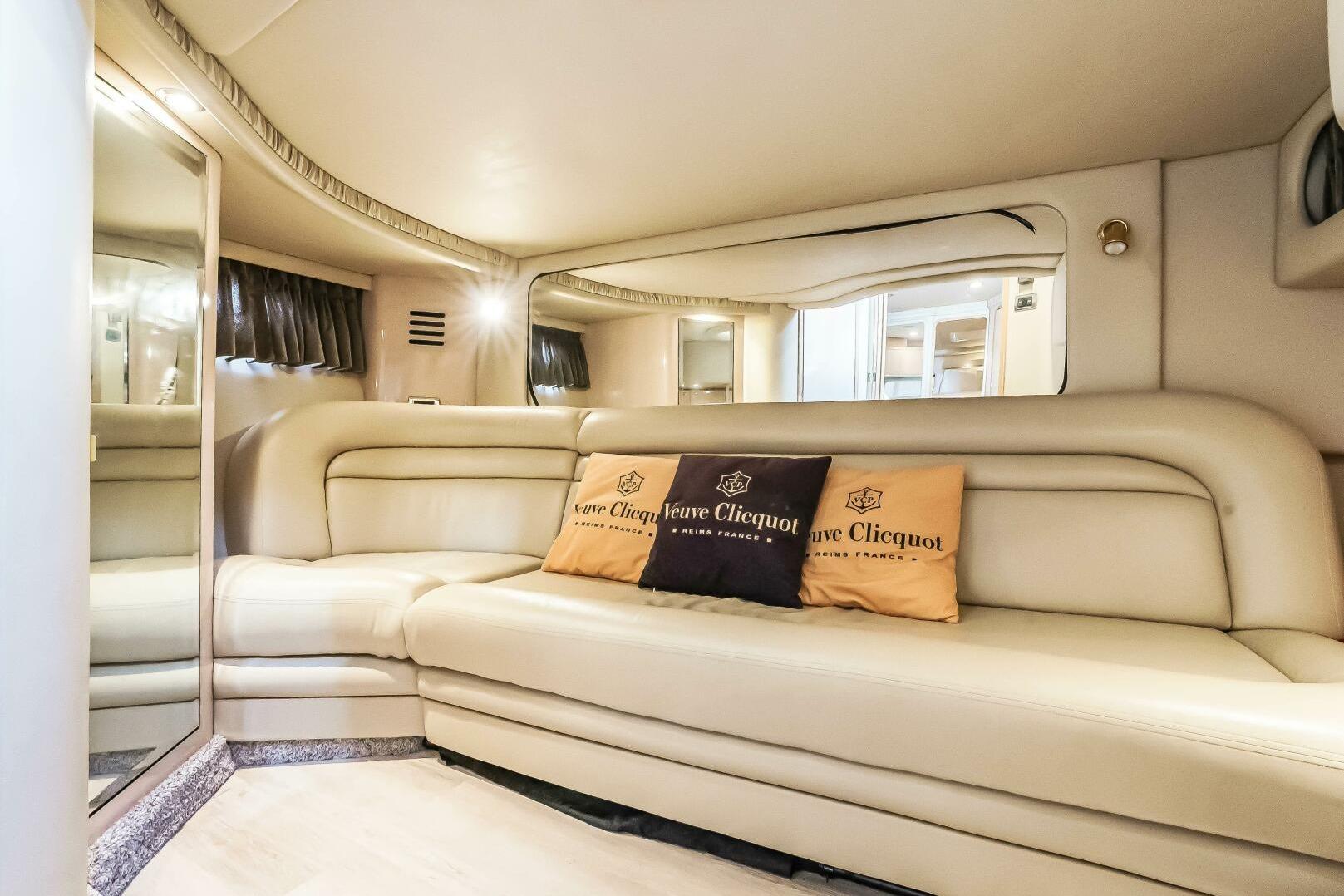 Luxurious interior of 2003 Sea Ray Sundancer 460 yacht with plush seating and elegant decor.