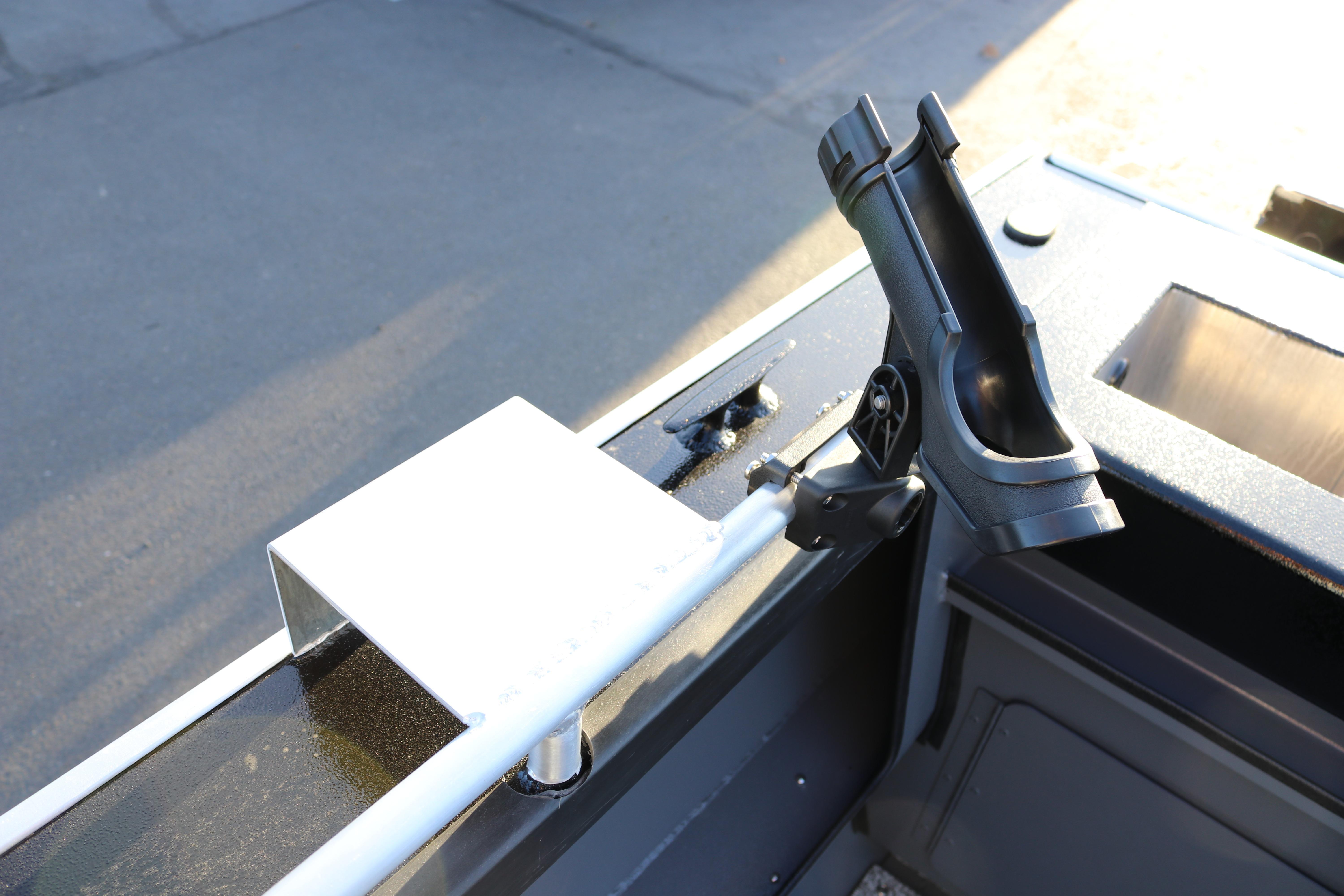 2026 Alumaweld Stryker X202 boat detail with rod holder and metal bracket.