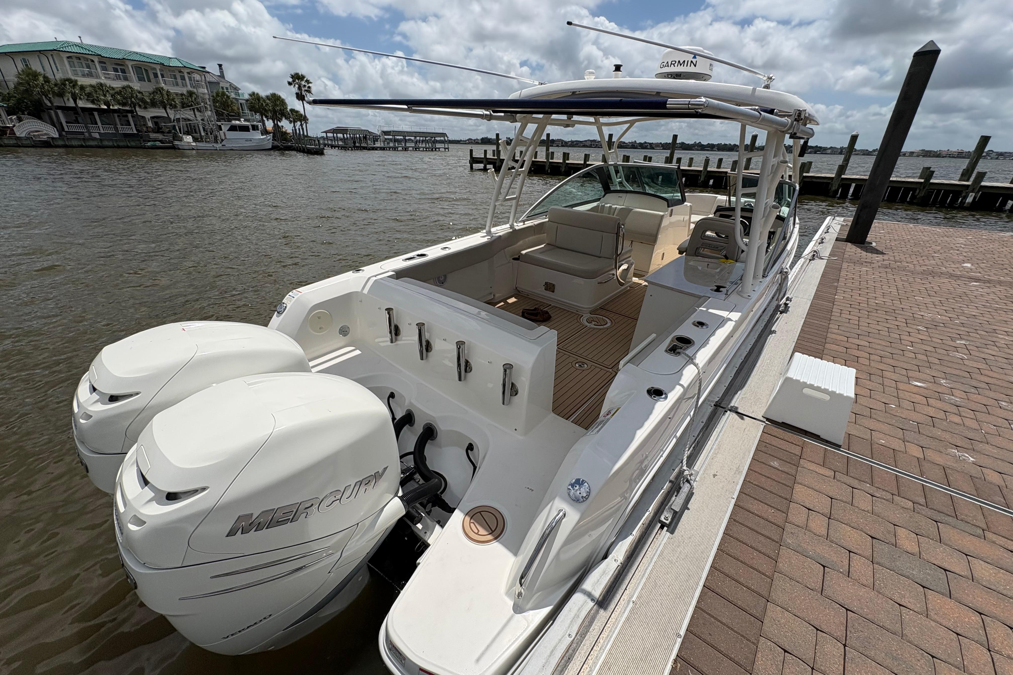 2017 Boston Whaler 270 Vantage boat docked, featuring dual Mercury engines.