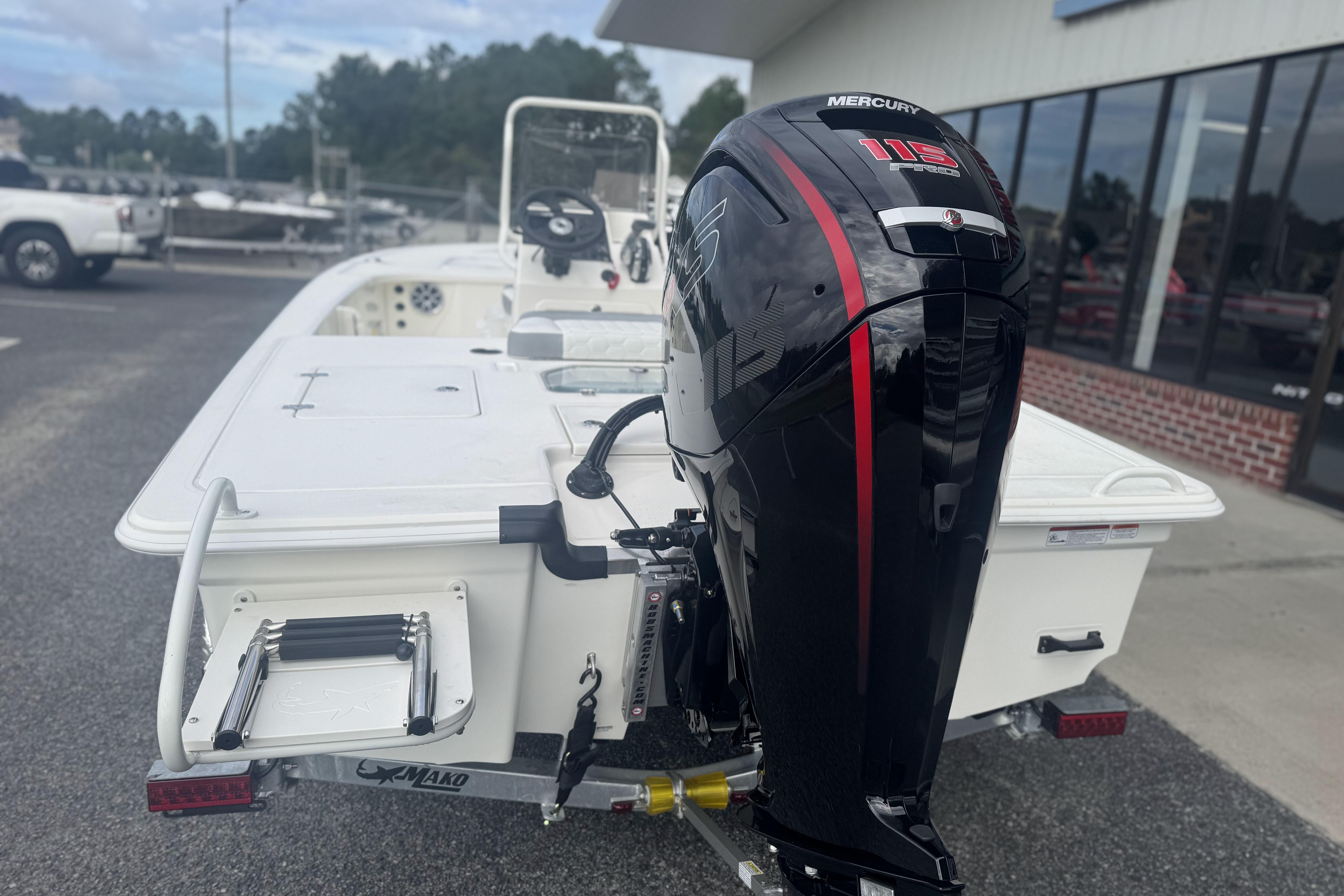 2026 Mako 18 Pro Skiff with Mercury 115 outboard motor, parked outdoors.