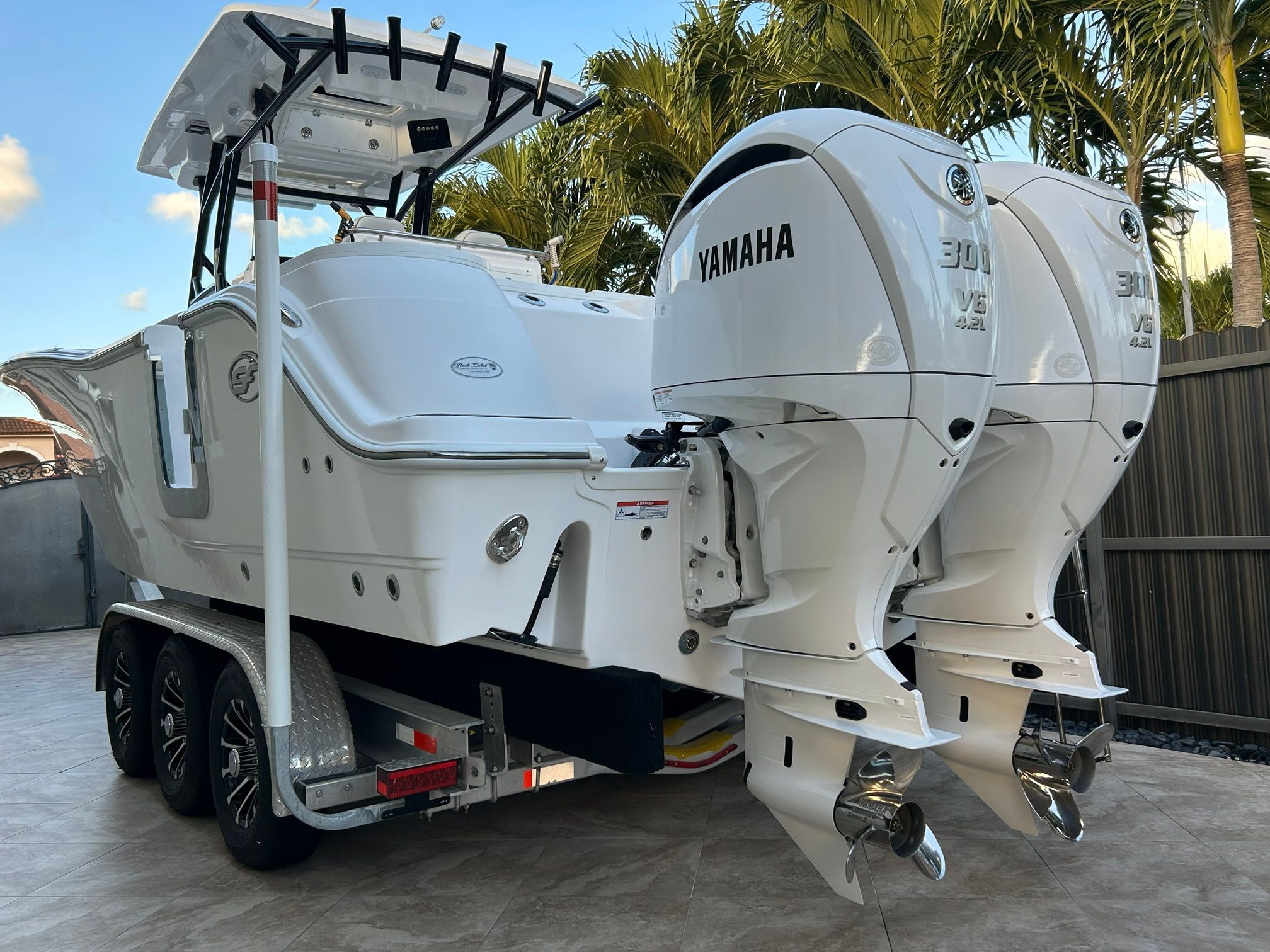 A 2023 Sea Fox 288 Commander with twin Yamaha 300 HP outboard engines on a trailer.