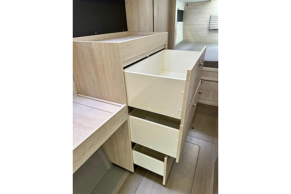 Wooden drawers in a 2017 Leopard 40 interior, showcasing ample storage space.